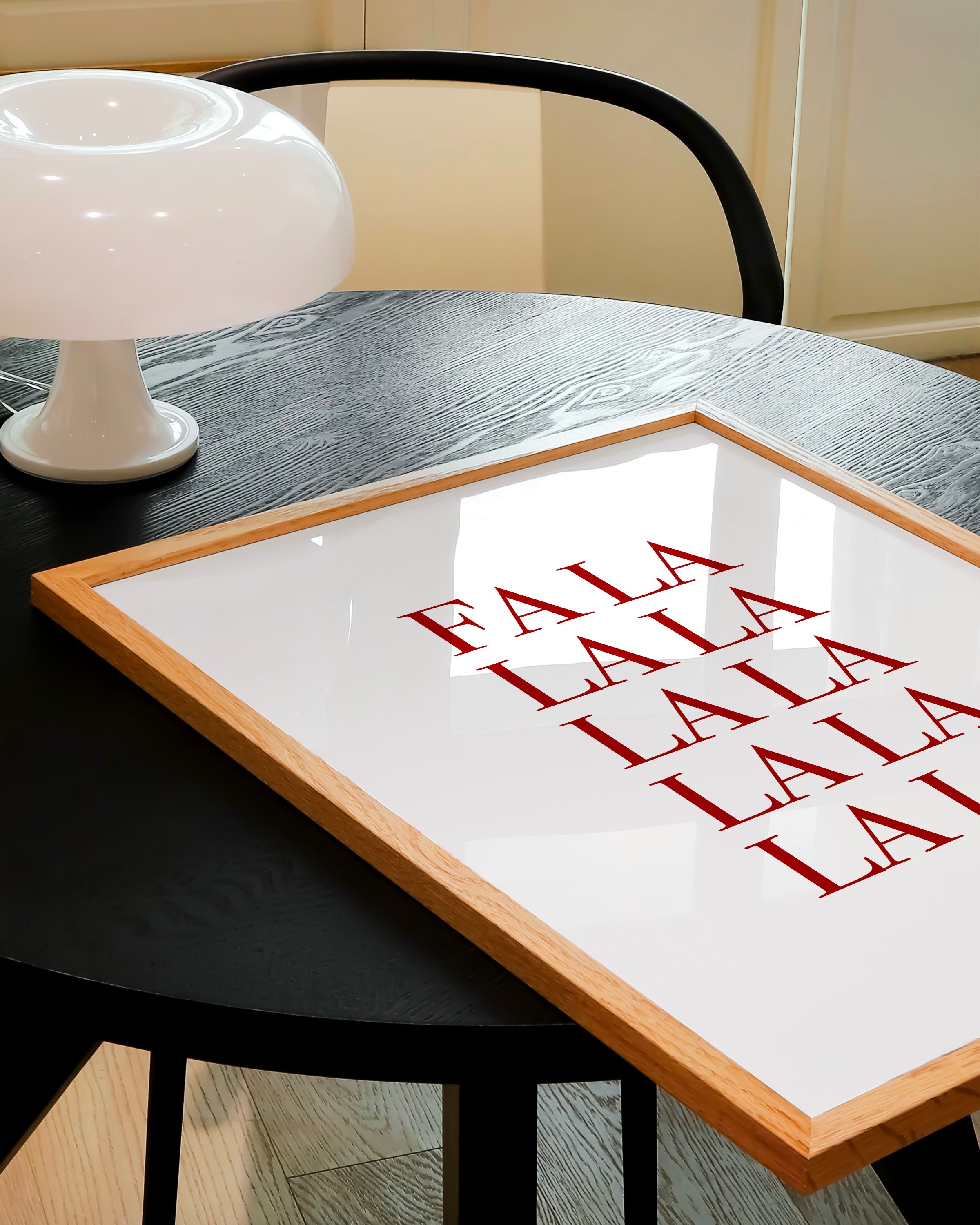 “Fa La La” in bold red typography stacked vertically on a white background, ideal for festive holiday decor.