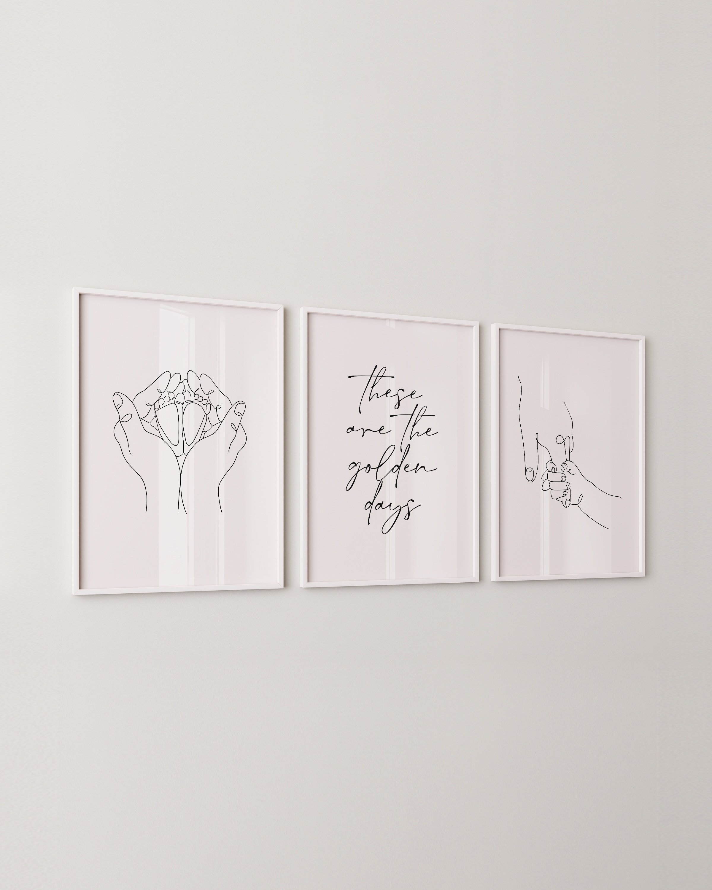Set of 3 minimalist line art prints featuring hand-holding design, baby feet in hands, and the phrase “these are the golden days” in elegant typography.