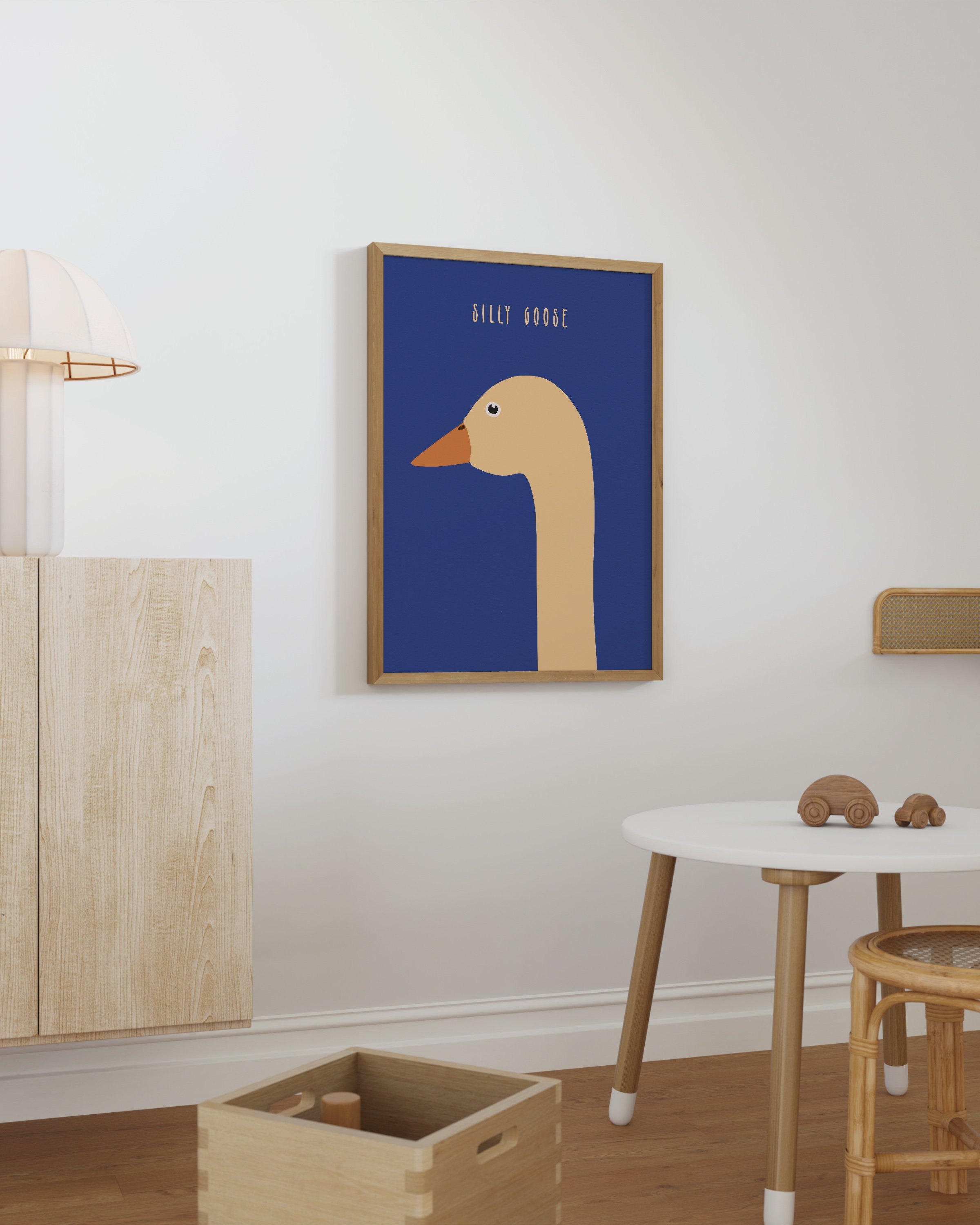Printable wall art featuring a minimalist goose illustration on a bold blue background with the text ‘Silly Goose’ in an elegant font.