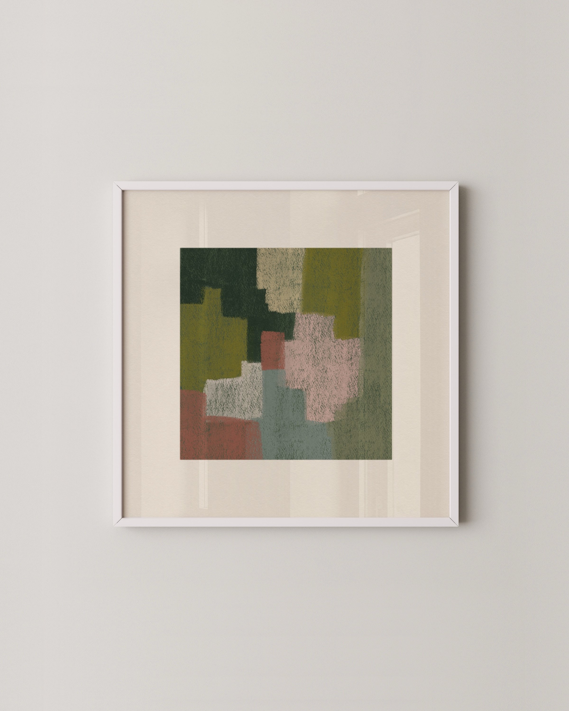 Set of two abstract wall art prints in earthy tones, displayed above a green sofa in a cozy living room.