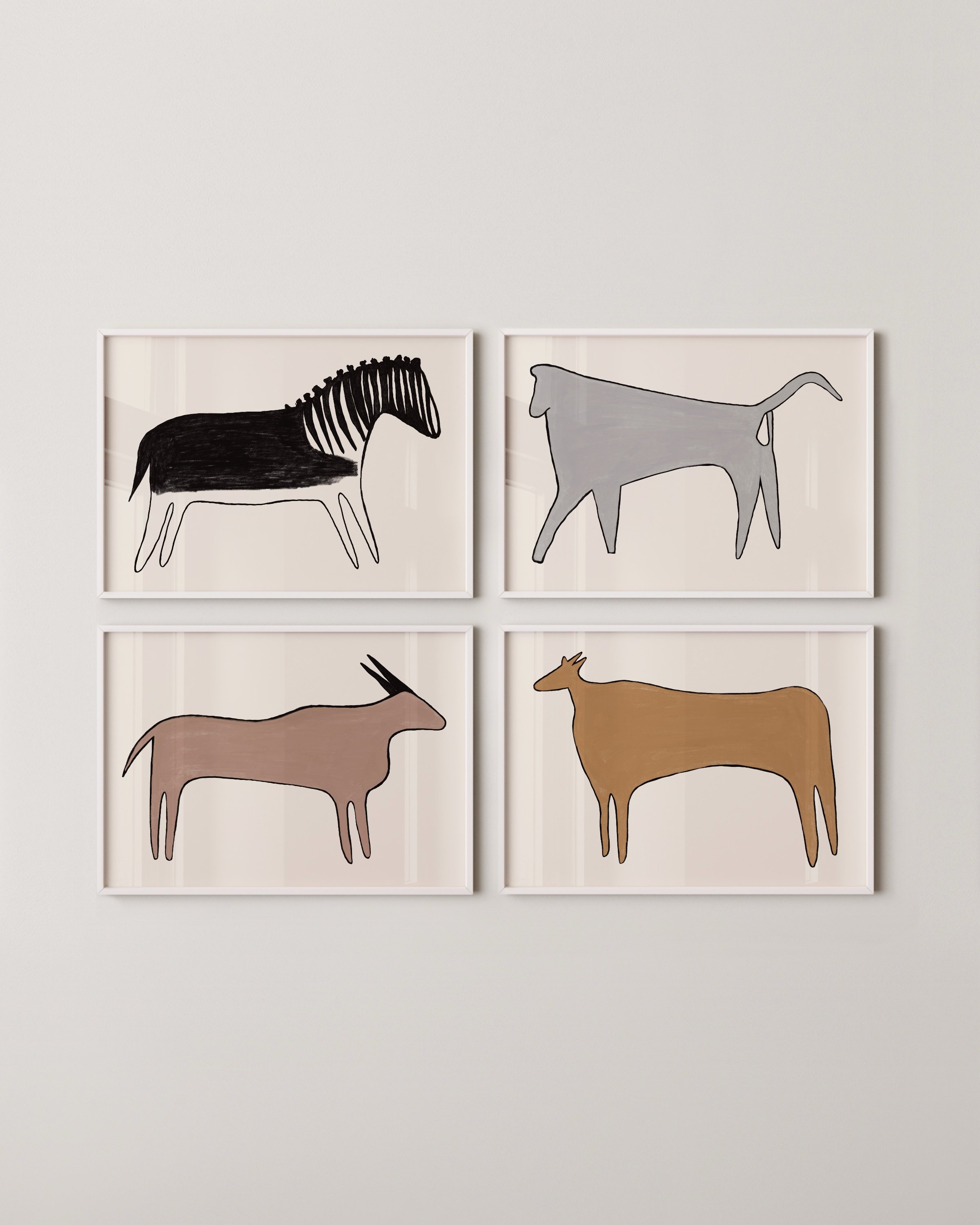 Set of four abstract animal illustrations featuring minimalist designs of a zebra, deer, antelope, and cow, each with a unique and modern artistic style.