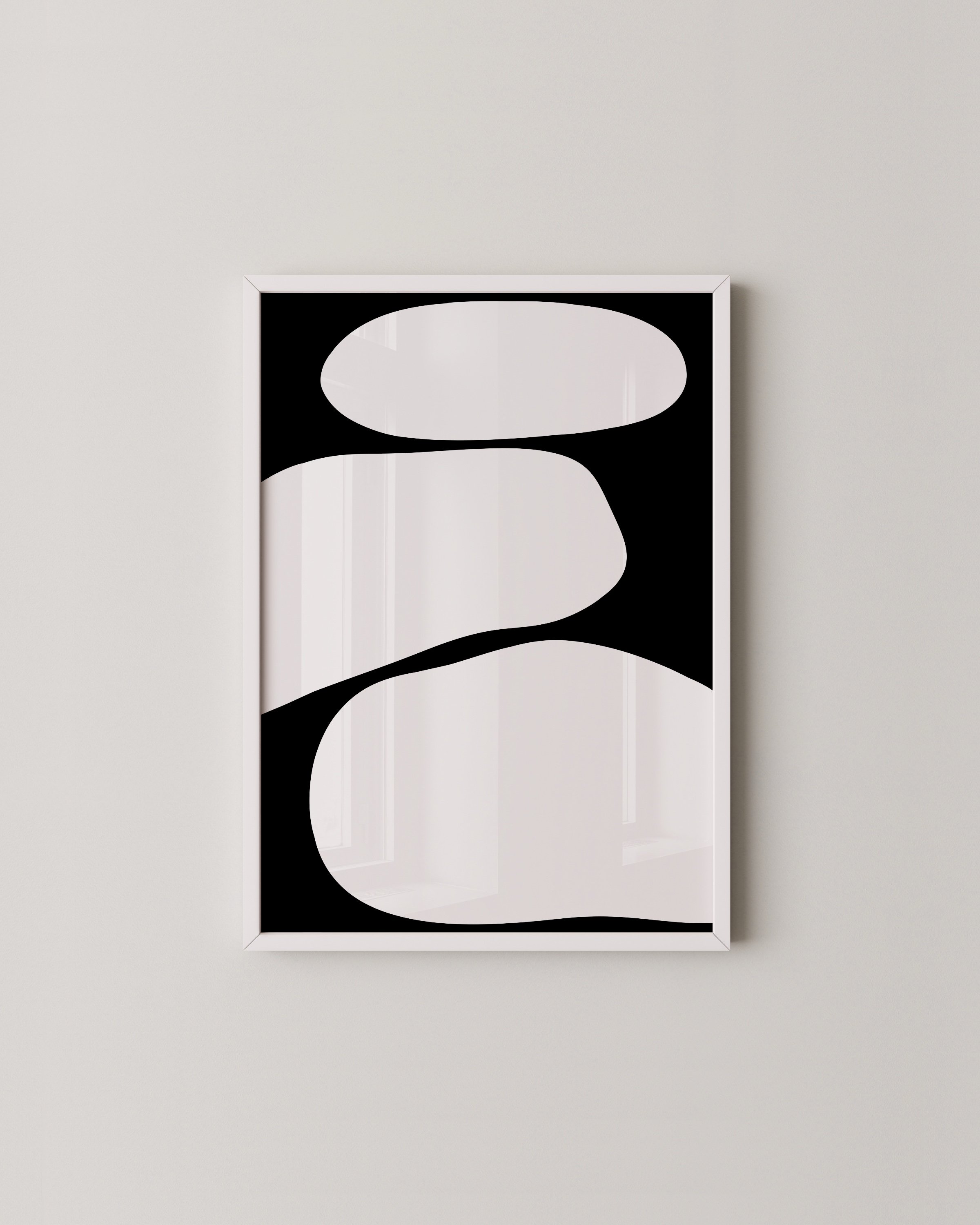 A set of three abstract black and white art prints featuring bold, minimalist shapes in a cohesive triptych design.