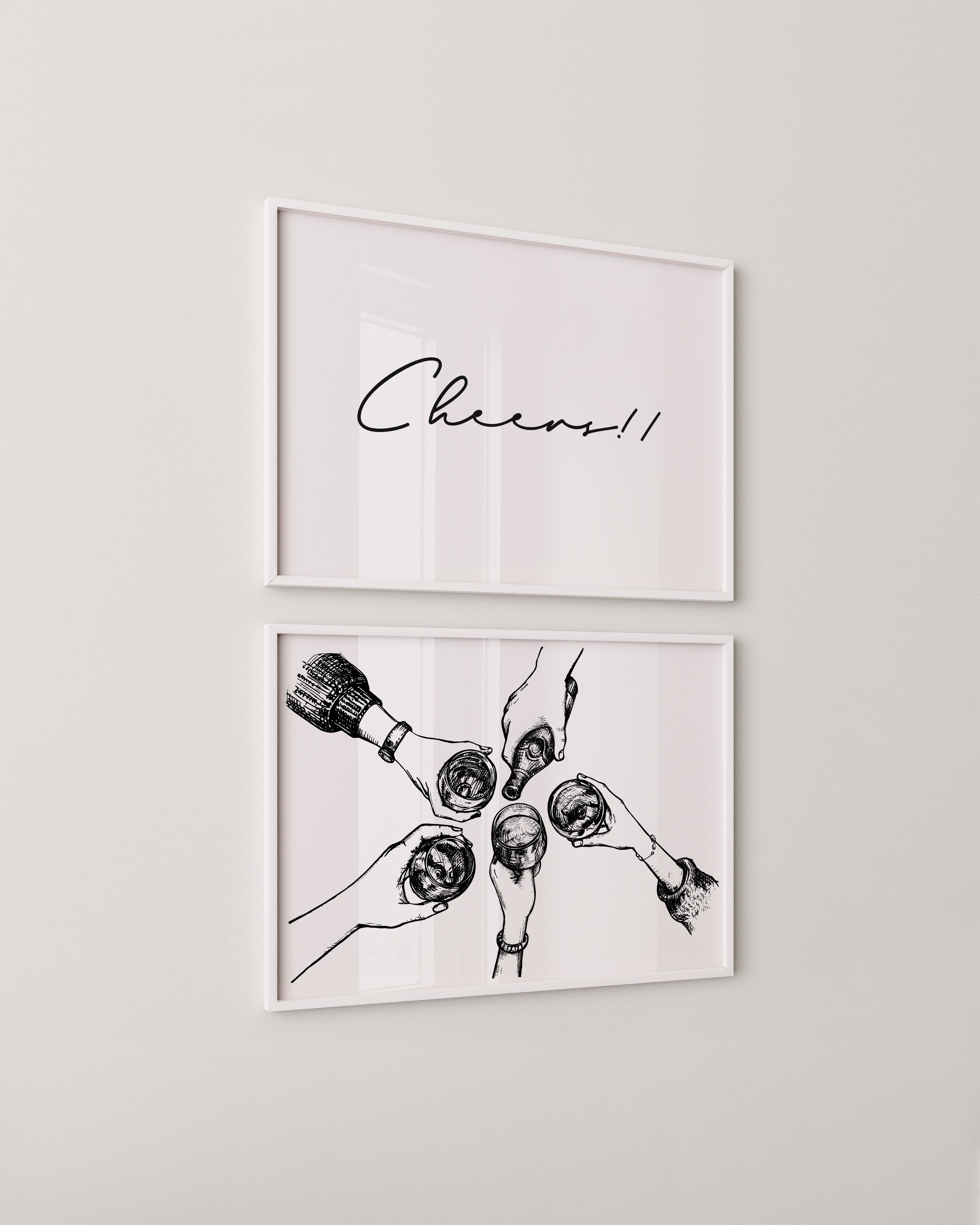 Minimalist black-and-white printable set featuring a ‘Cheers!!’ script and a hand-drawn toast scene, displayed in sleek white frames on a neutral wall.