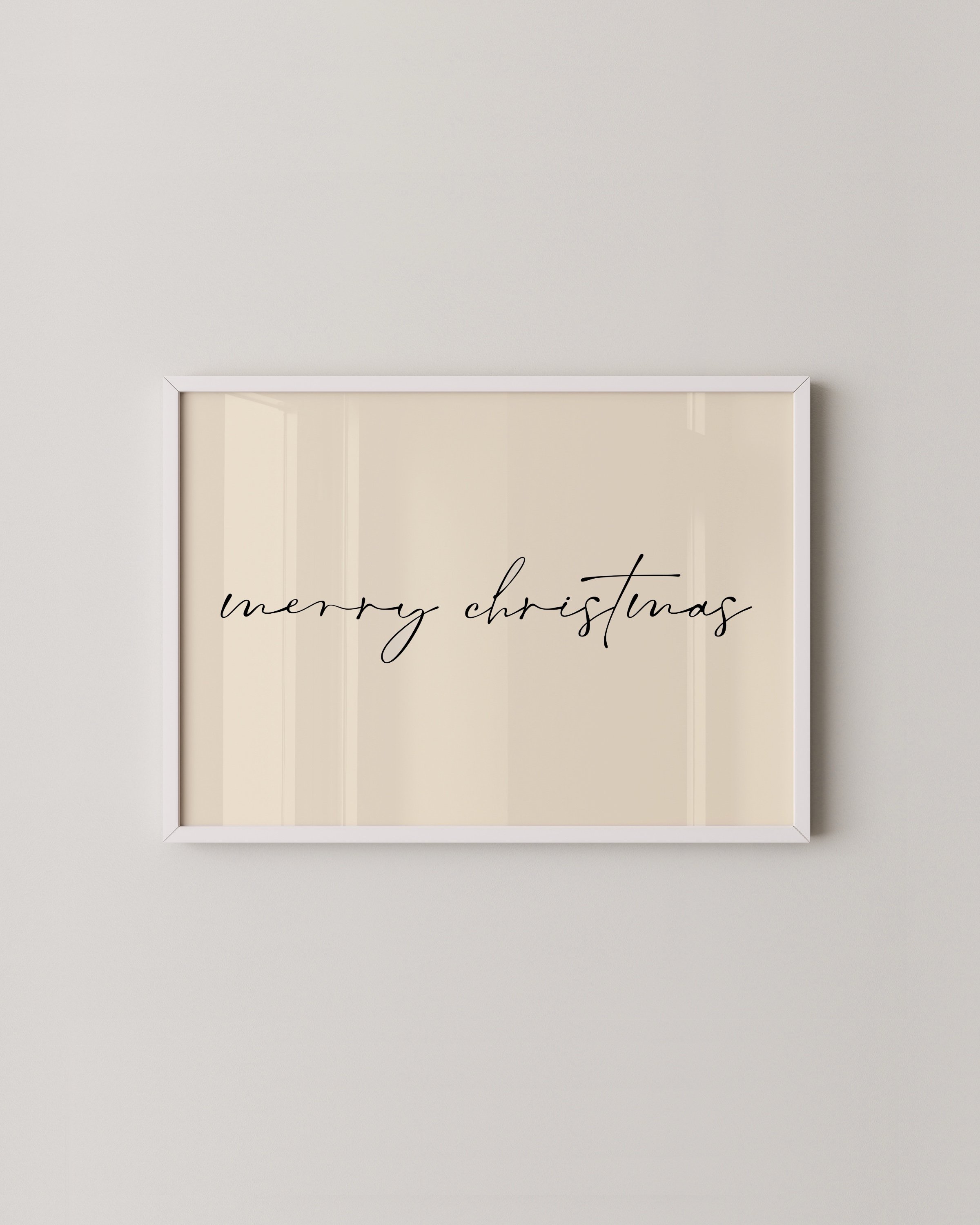 Minimalist Merry Christmas wall art with black calligraphy on a light background