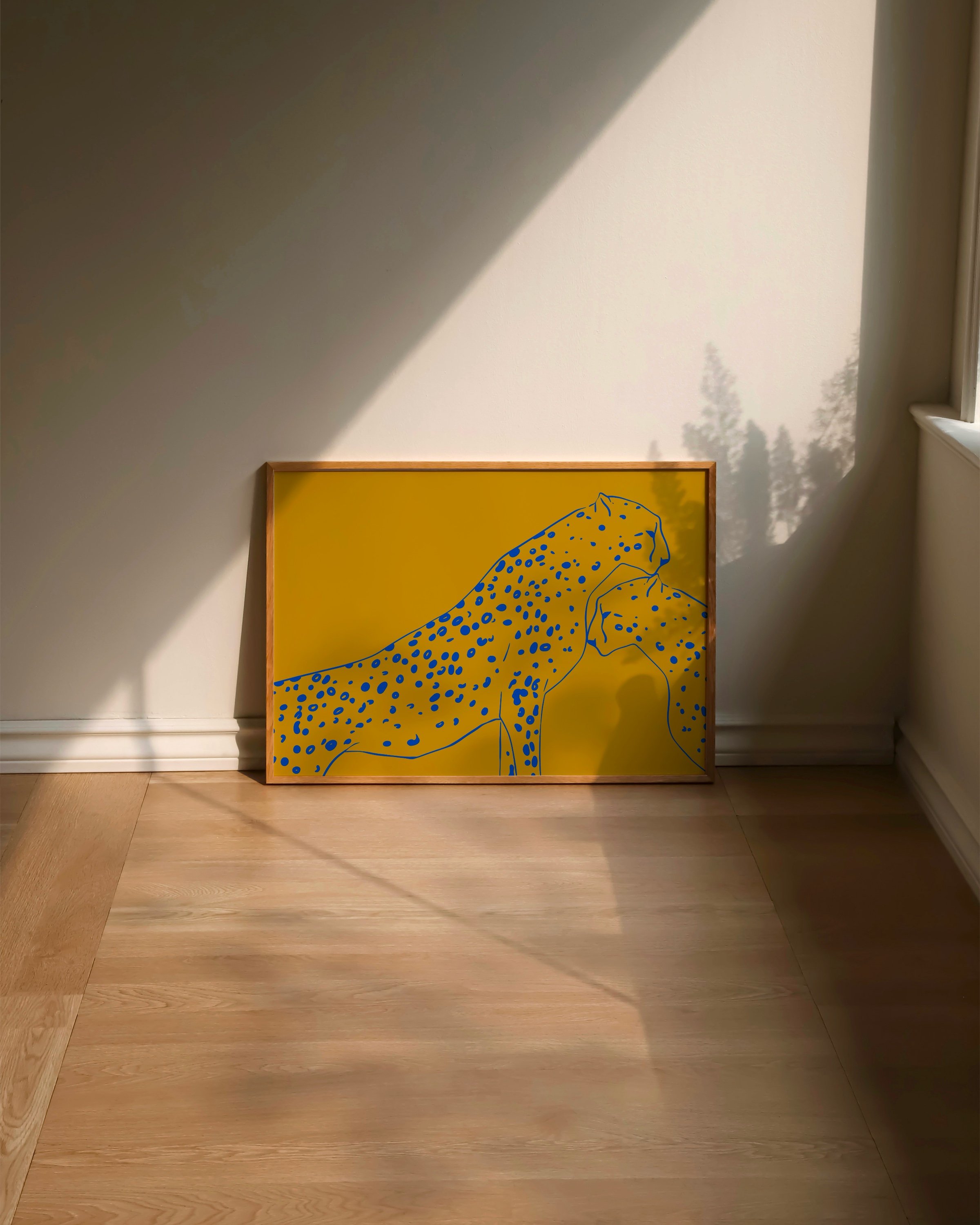 Modern cheetah wall art for kids in mustard yellow and cobalt blue, perfect for playful nursery or children’s room decor.