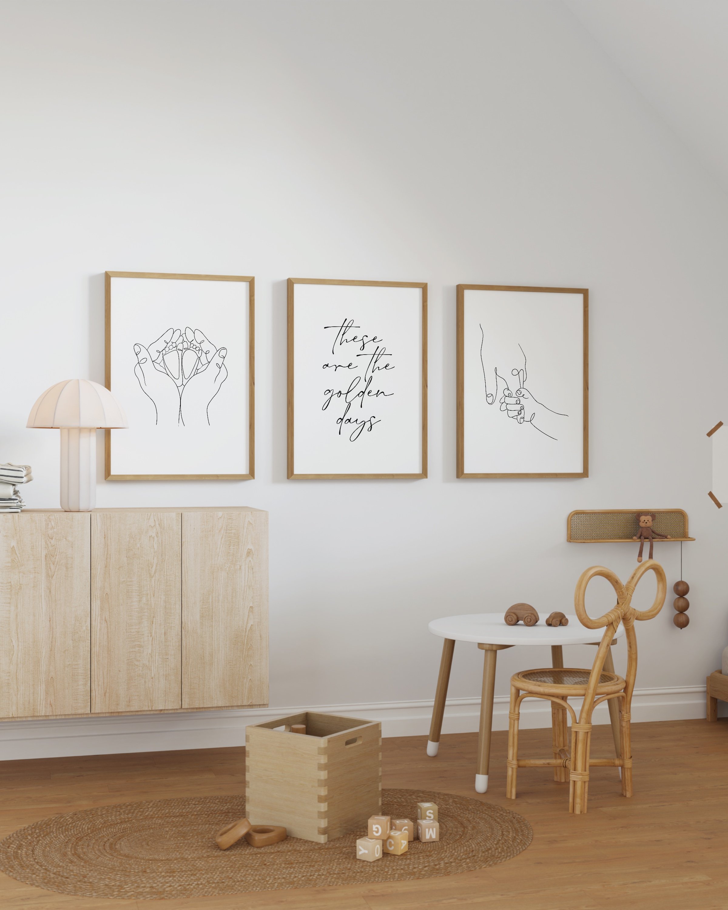 Set of 3 minimalist line art prints featuring hand-holding design, baby feet in hands, and the phrase “these are the golden days” in elegant typography.