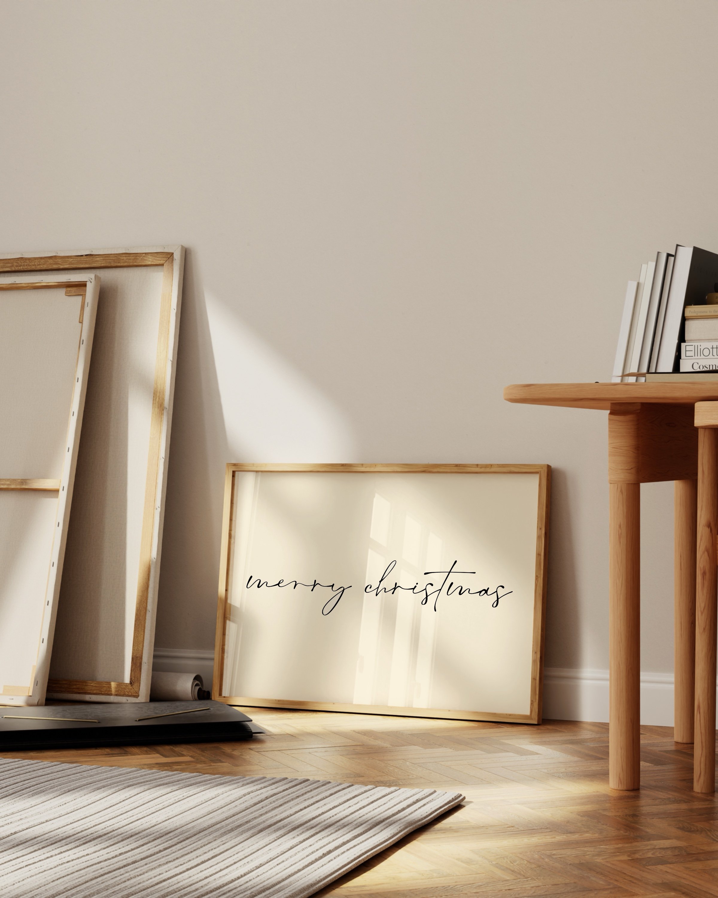 Minimalist Merry Christmas wall art with black calligraphy on a light background