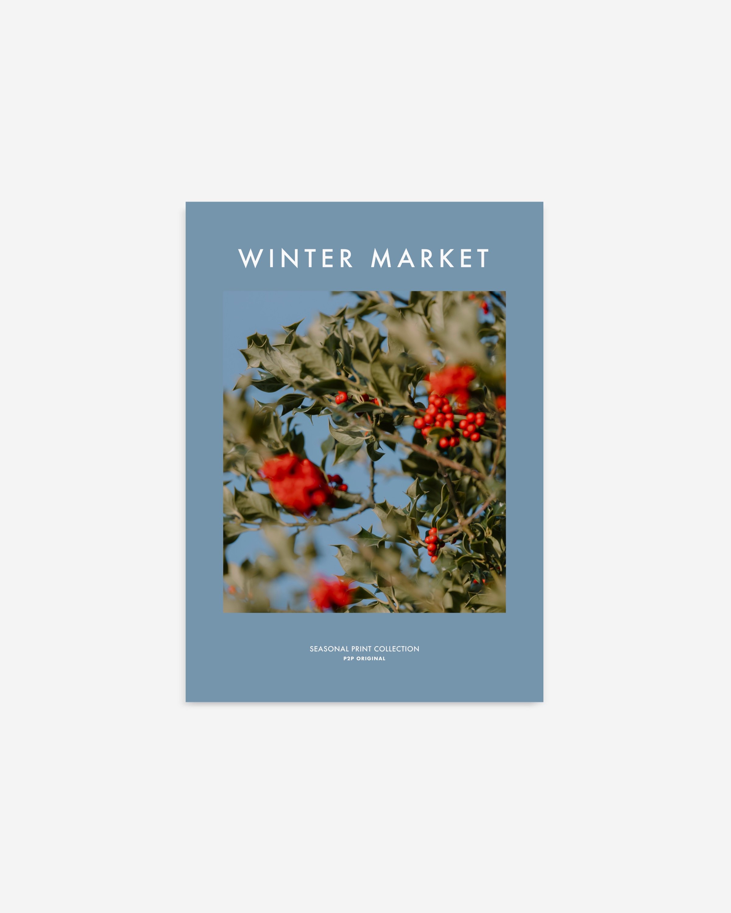 Winter Market seasonal printable wall art featuring a vibrant photo of holly berries with green leaves on a soft blue background.
