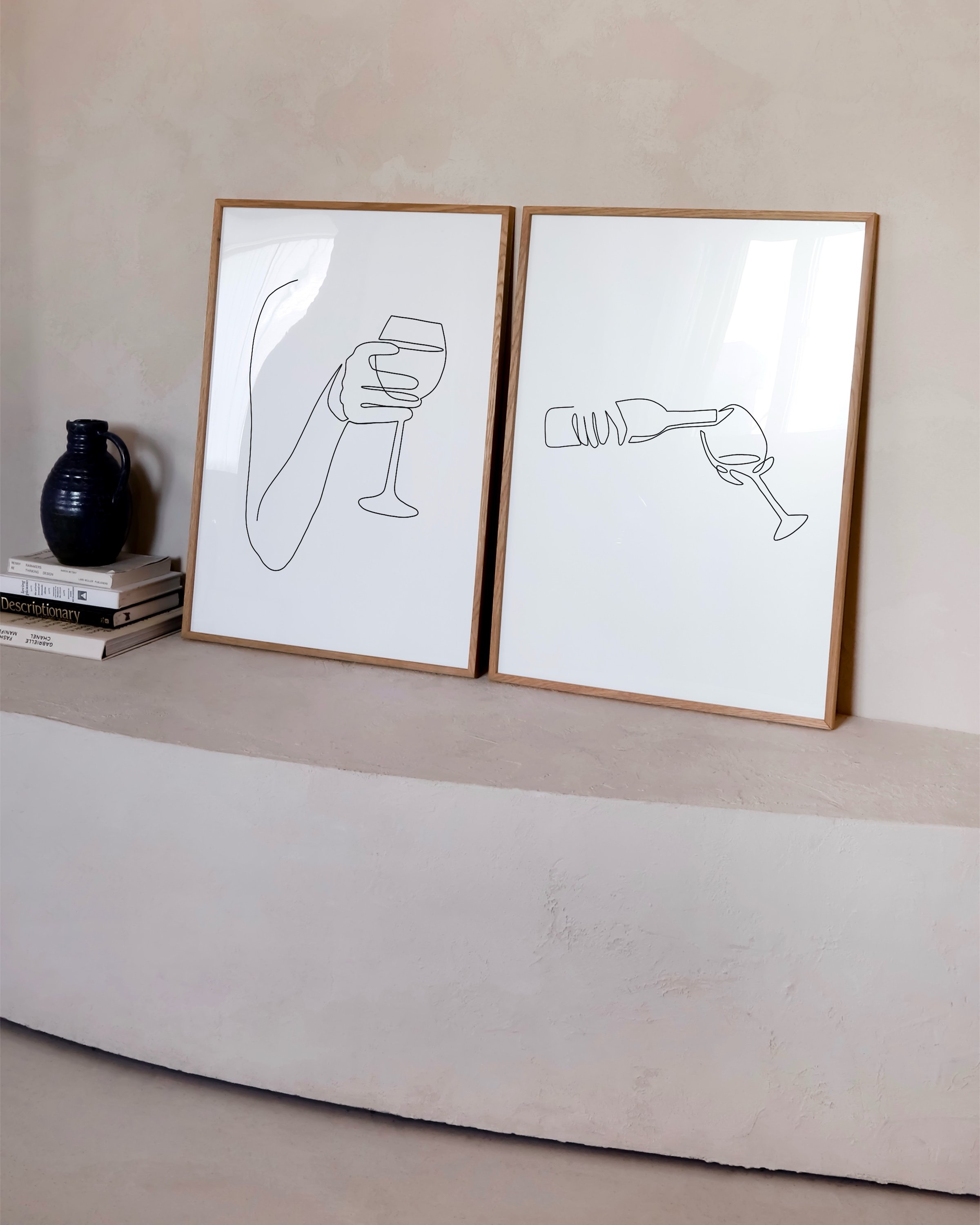 Minimalist wine art set with line drawings of a hand holding a wine glass and pouring wine from a bottle, ideal for modern decor.