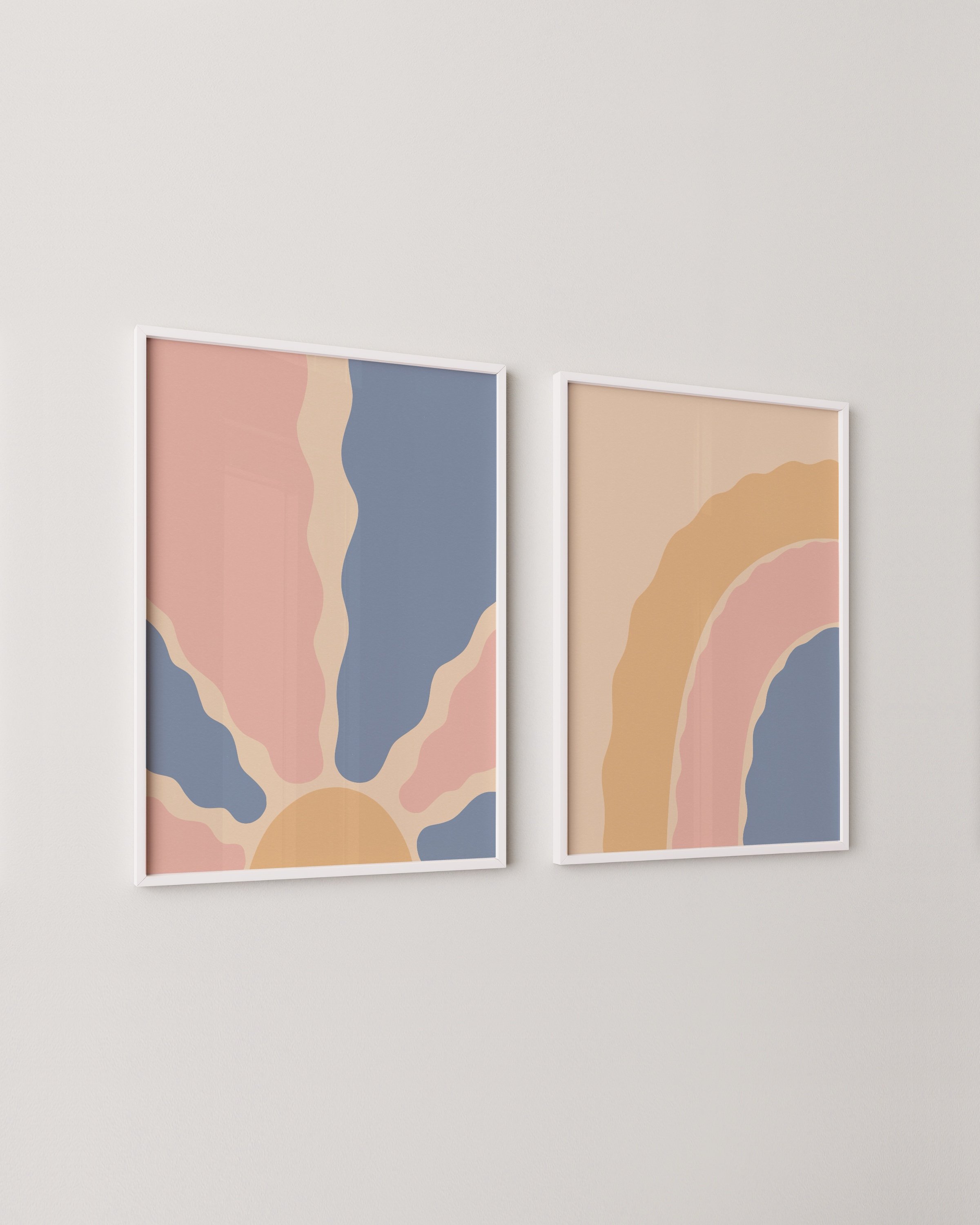 Two abstract boho printable wall art pieces: one featuring a sunburst with wavy rays, and the other a pastel rainbow in pink, blue, and beige tones.