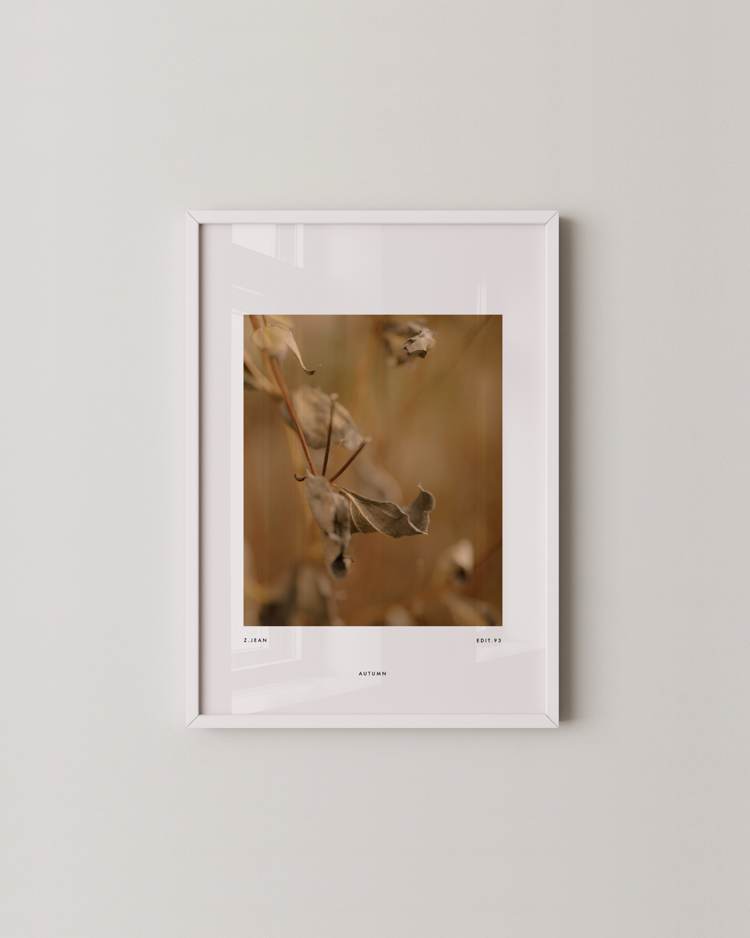 Set of three minimalist autumn wall art prints featuring close-up photography of golden and brown leaves in a warm and earthy color palette.