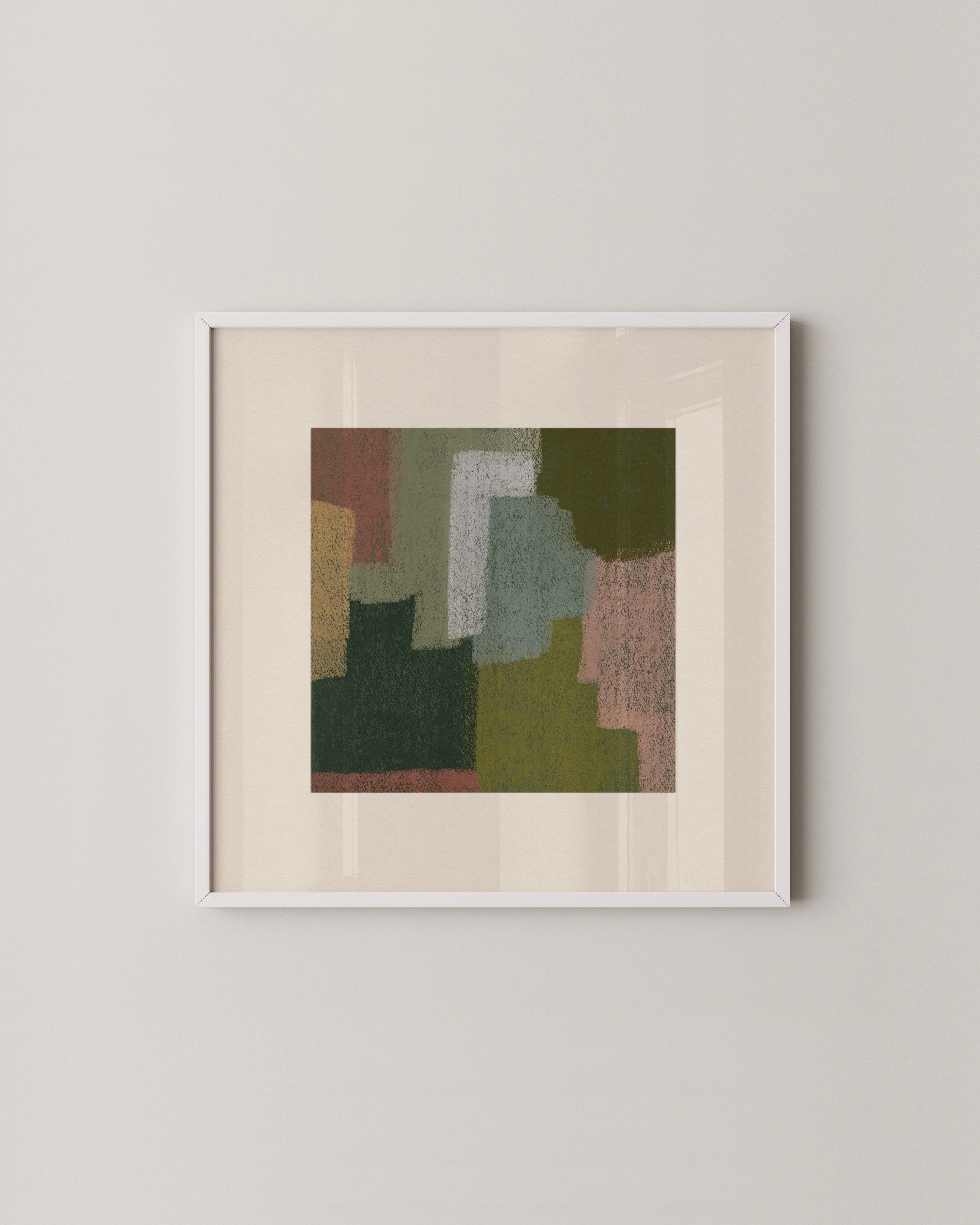 Set of two abstract wall art prints in earthy tones, displayed above a green sofa in a cozy living room.