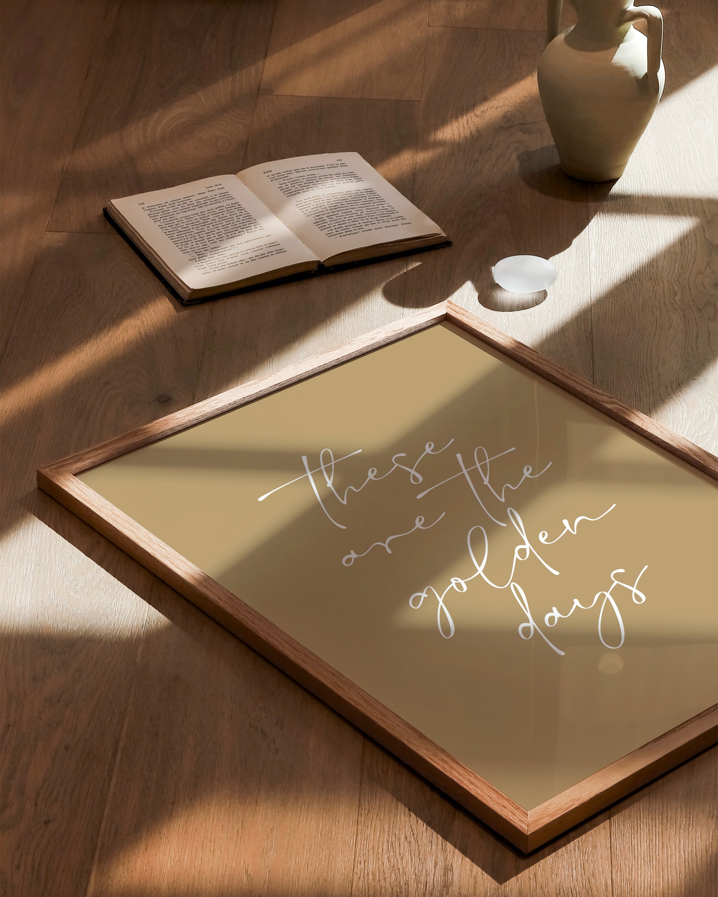 Minimalist wall art with the inspirational quote ‘These Are the Golden Days’ in elegant script.