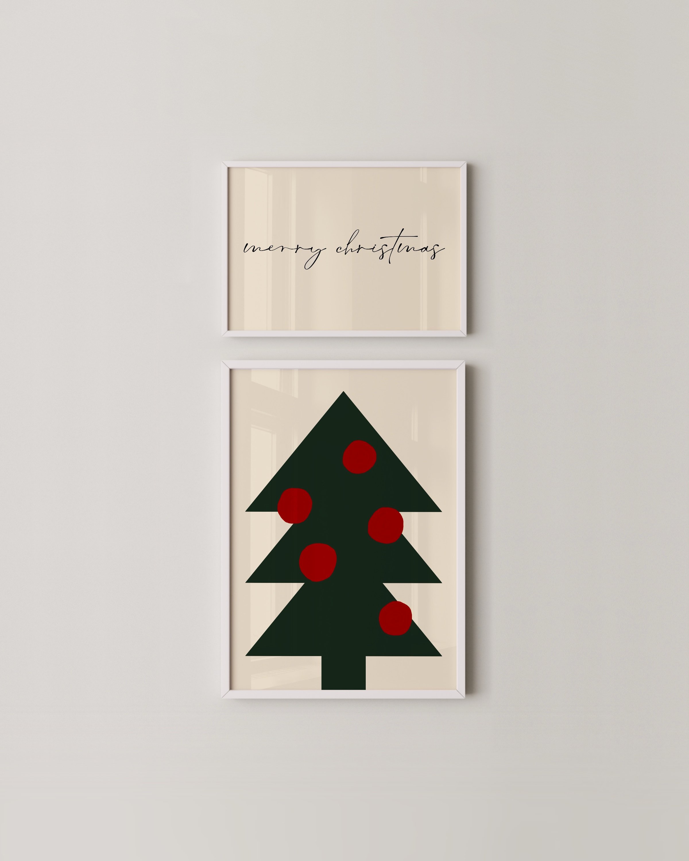 A two-piece minimalist Christmas wall art set featuring a green tree with red ornaments and a “Merry Christmas” script on a neutral background.