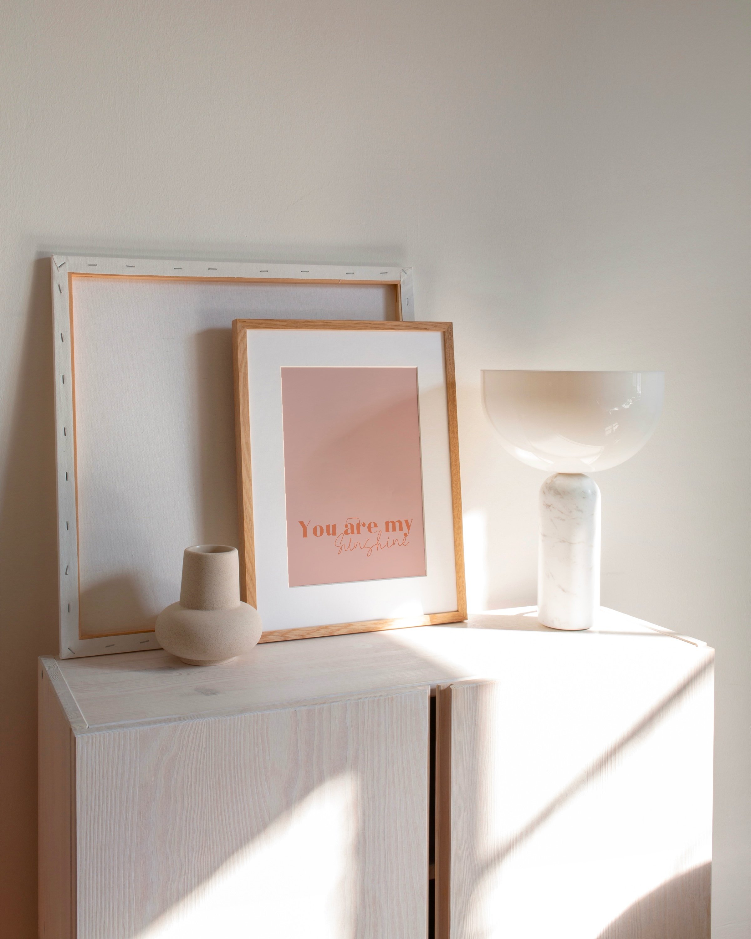 “You Are My Sunshine” wall art in warm peach tones, featuring an inspirational quote in a minimalist style.