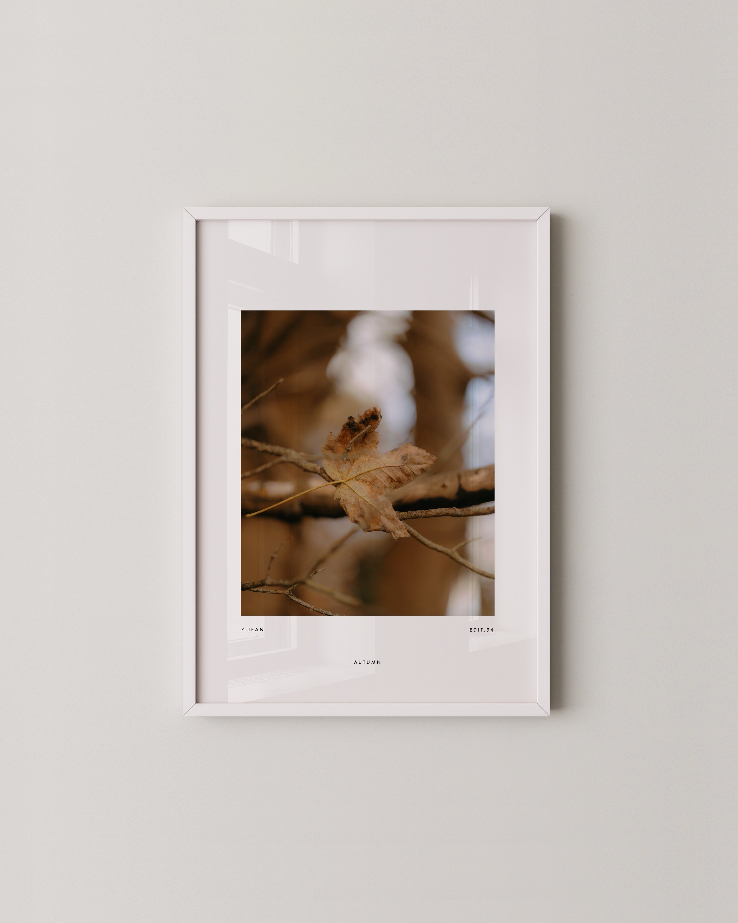 Set of three minimalist autumn wall art prints featuring close-up photography of golden and brown leaves in a warm and earthy color palette.
