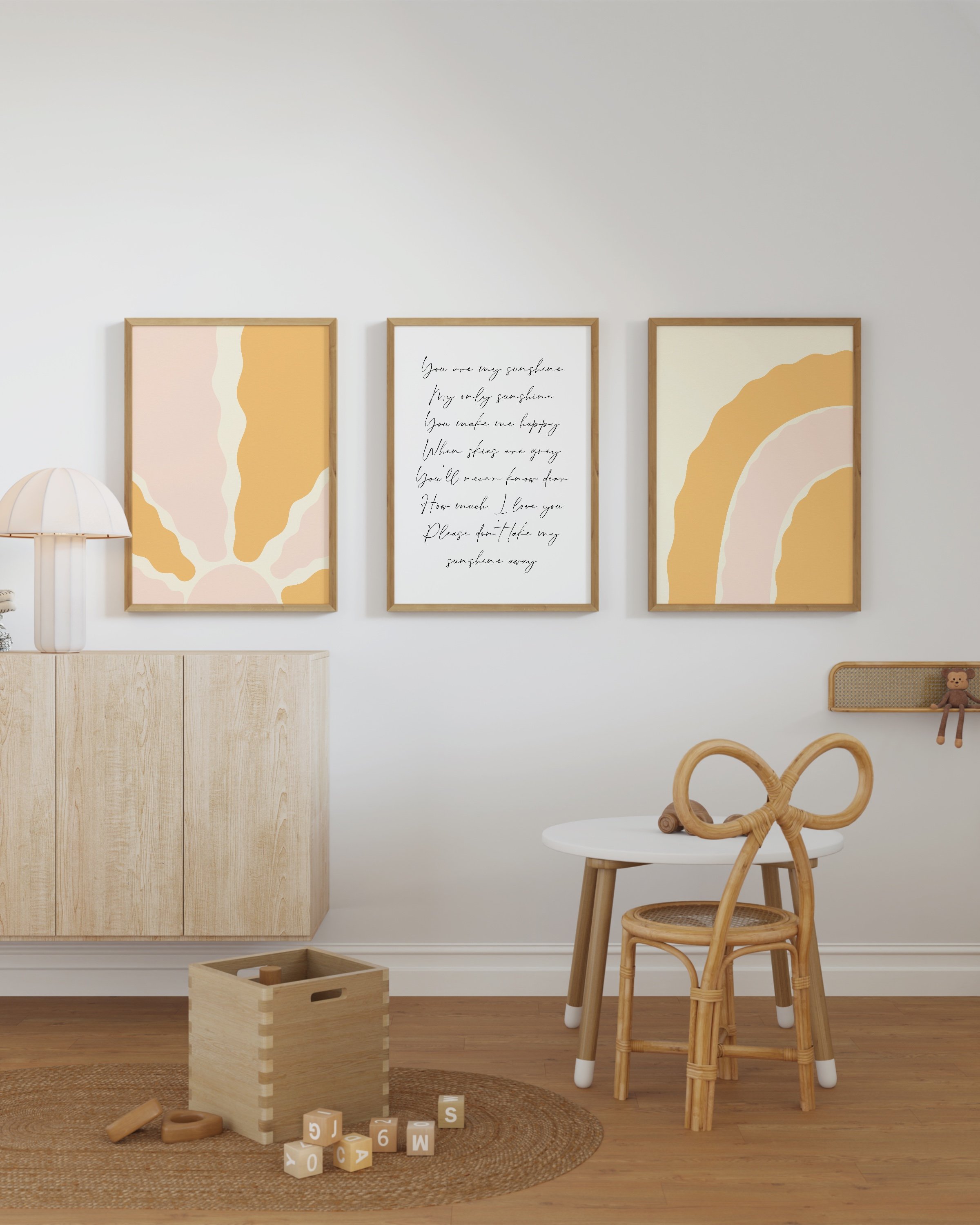 Set of 3 warm-toned prints including a minimalist sunburst, “You Are My Sunshine” lyric, and a soft rainbow design.