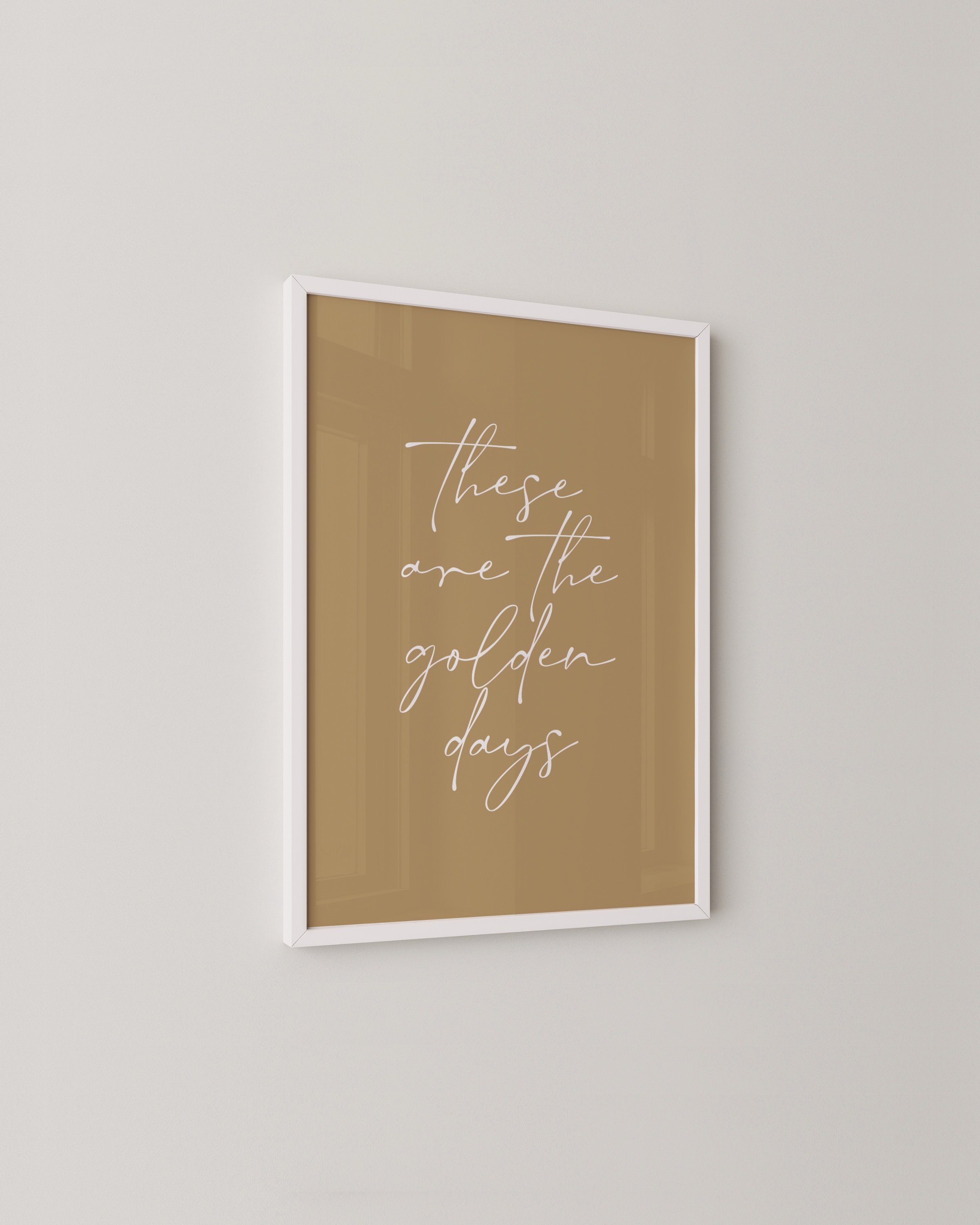 Minimalist wall art with the inspirational quote ‘These Are the Golden Days’ in elegant script.