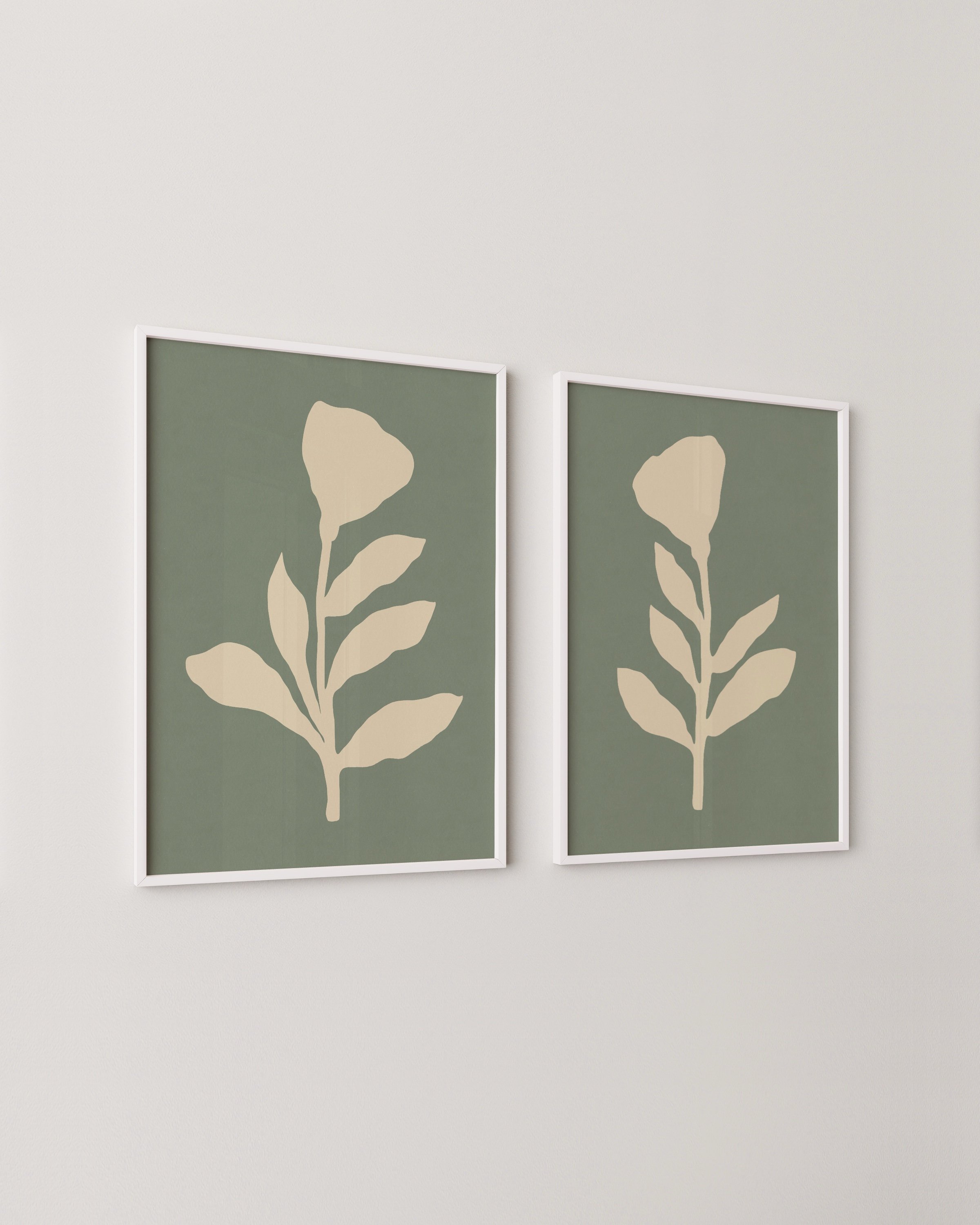Two prints featuring beige flower silhouettes with leafy stems on muted sage green backgrounds.