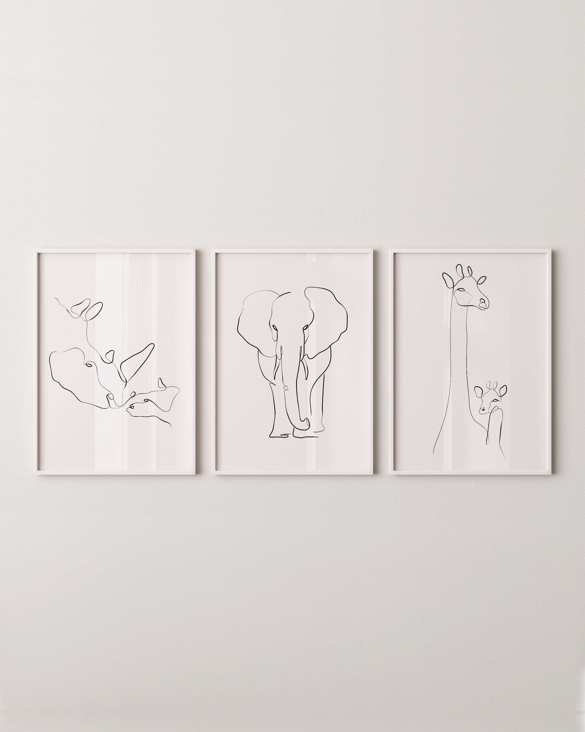 Minimalist black-and-white animal line art prints featuring an elephant, giraffe, and rhino, perfect for adding a modern touch to any space.