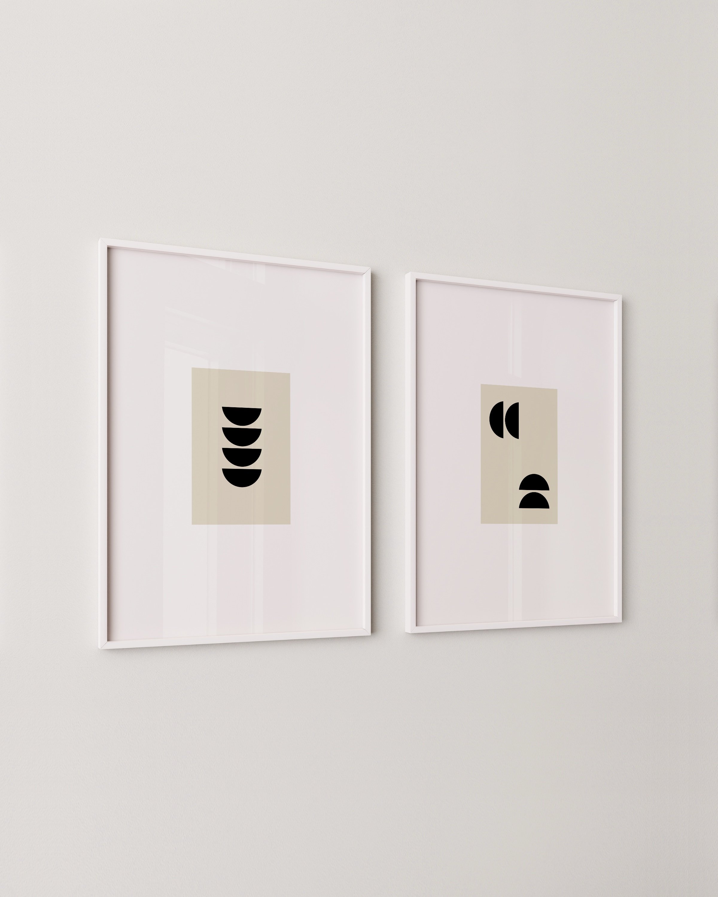 Pair of minimalist geometric prints, left print features a vertical stack of black half circles, right print shows scattered abstract shapes on beige backgrounds.