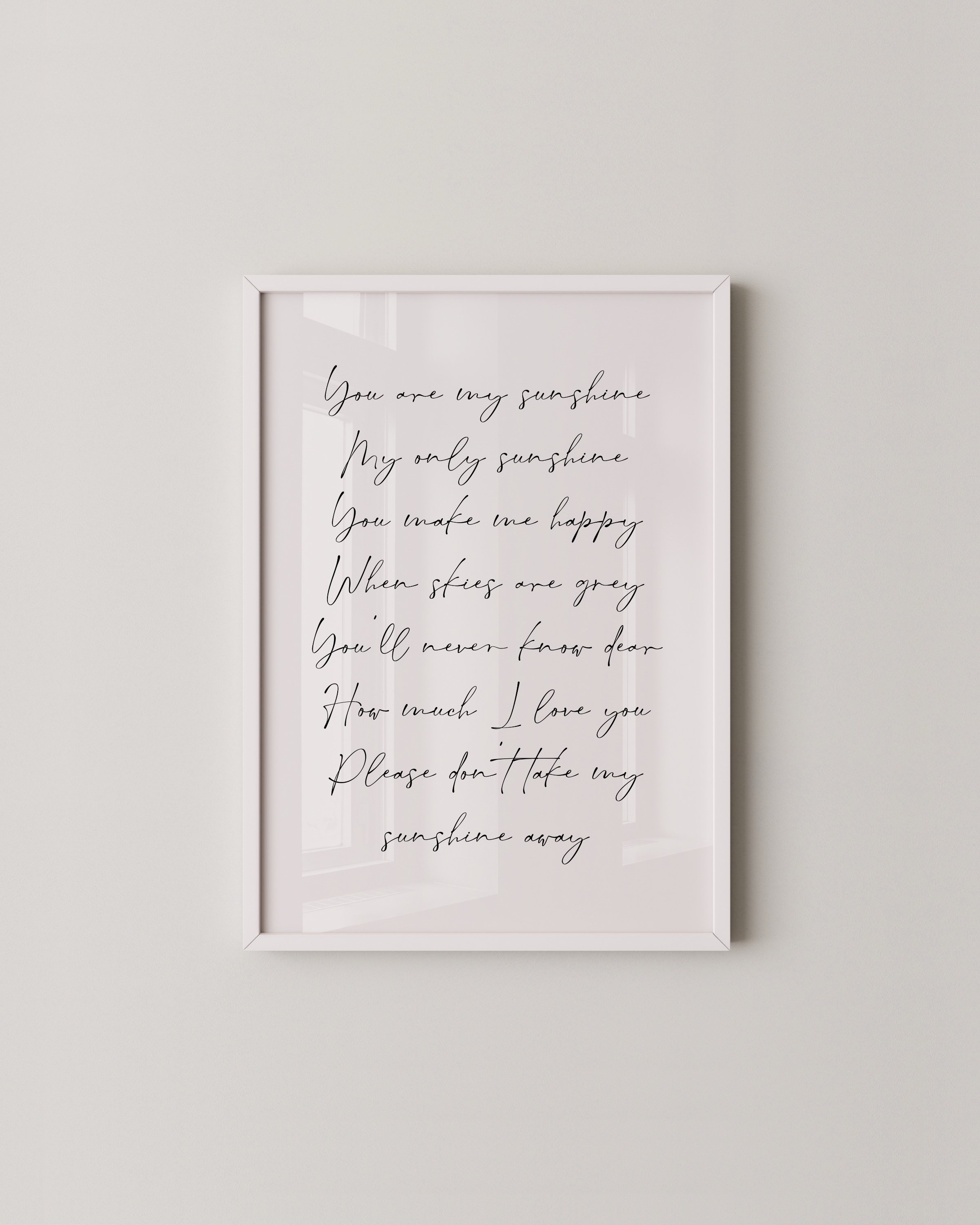 Set of 3 warm-toned prints including a minimalist sunburst, “You Are My Sunshine” lyric, and a soft rainbow design.