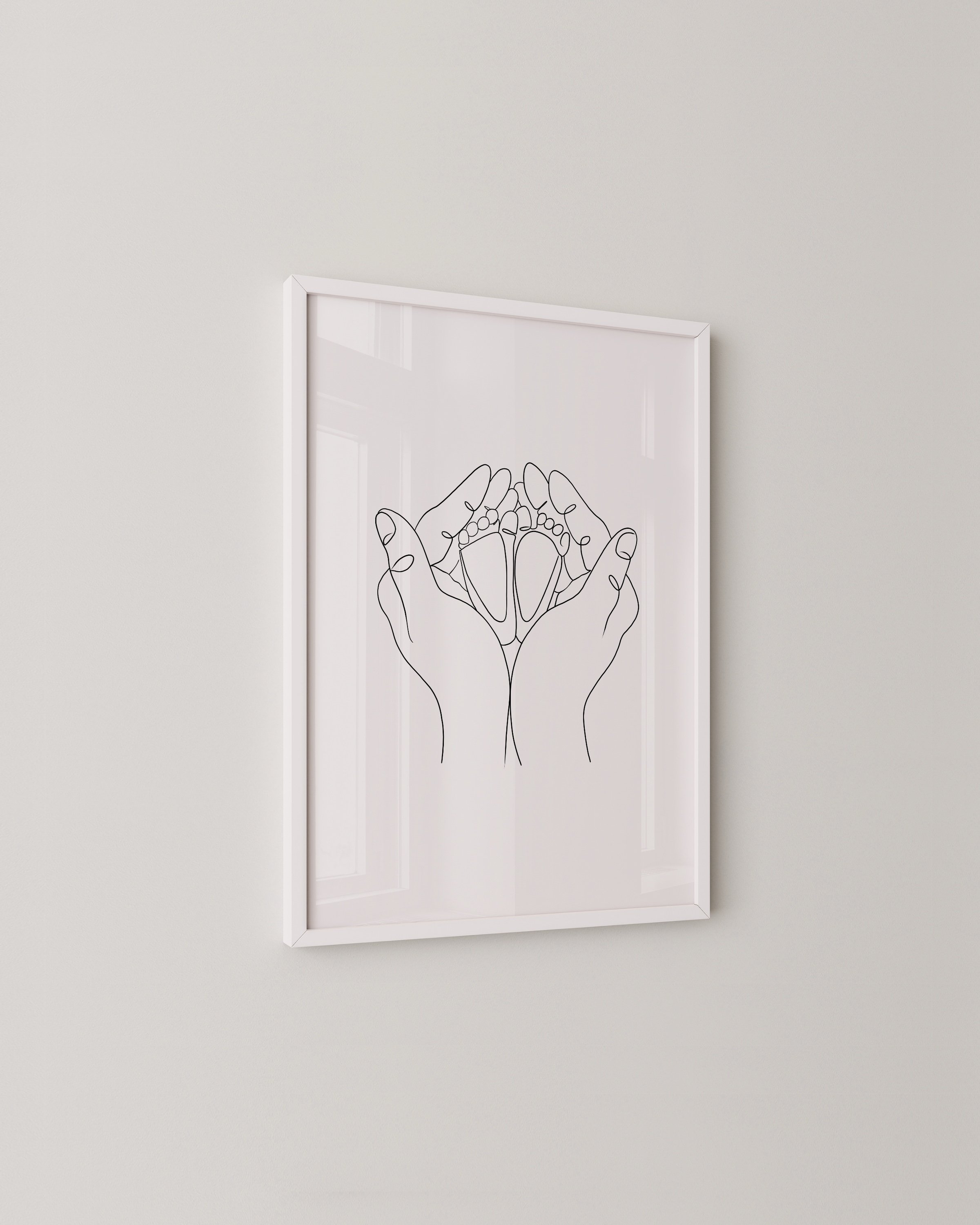 Line art of hands cradling baby feet, minimalist family artwork in a modern style.