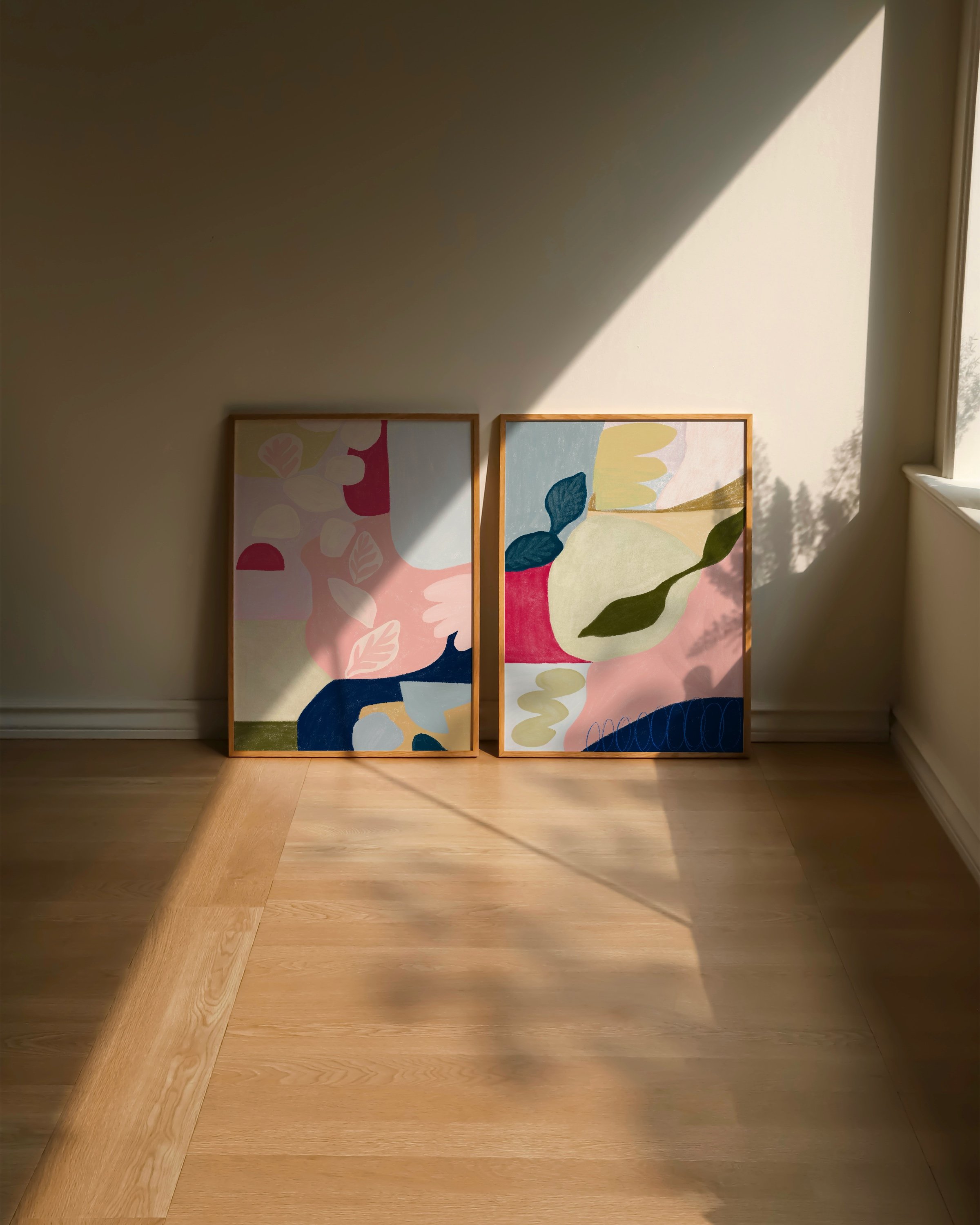 Set of two colorful abstract art prints featuring modern botanical designs, perfect for adding a vibrant touch to contemporary home decor.