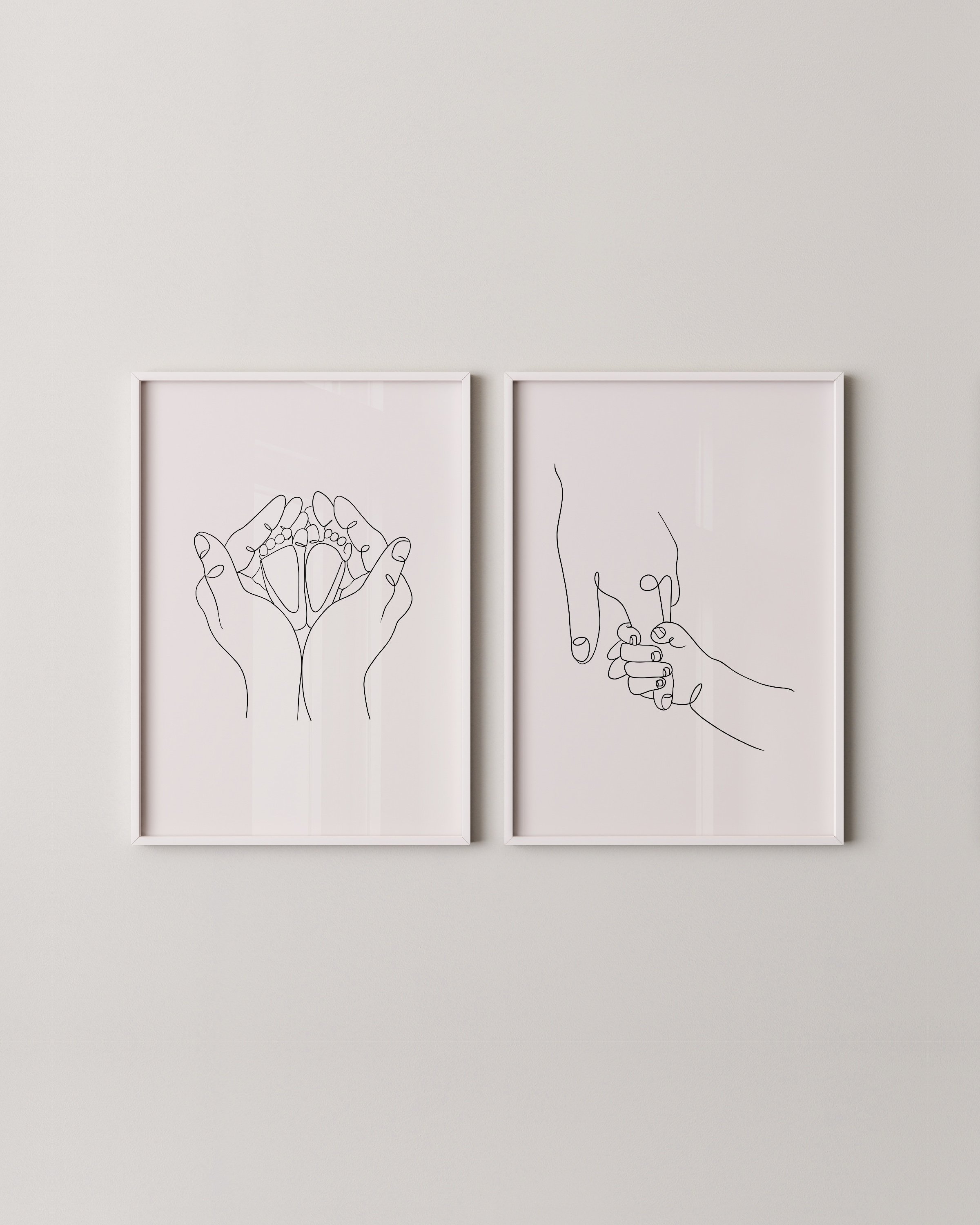 Minimalist line art print set featuring a parent’s hand holding a baby’s hand and hands cradling baby feet, perfect for modern nursery decor.