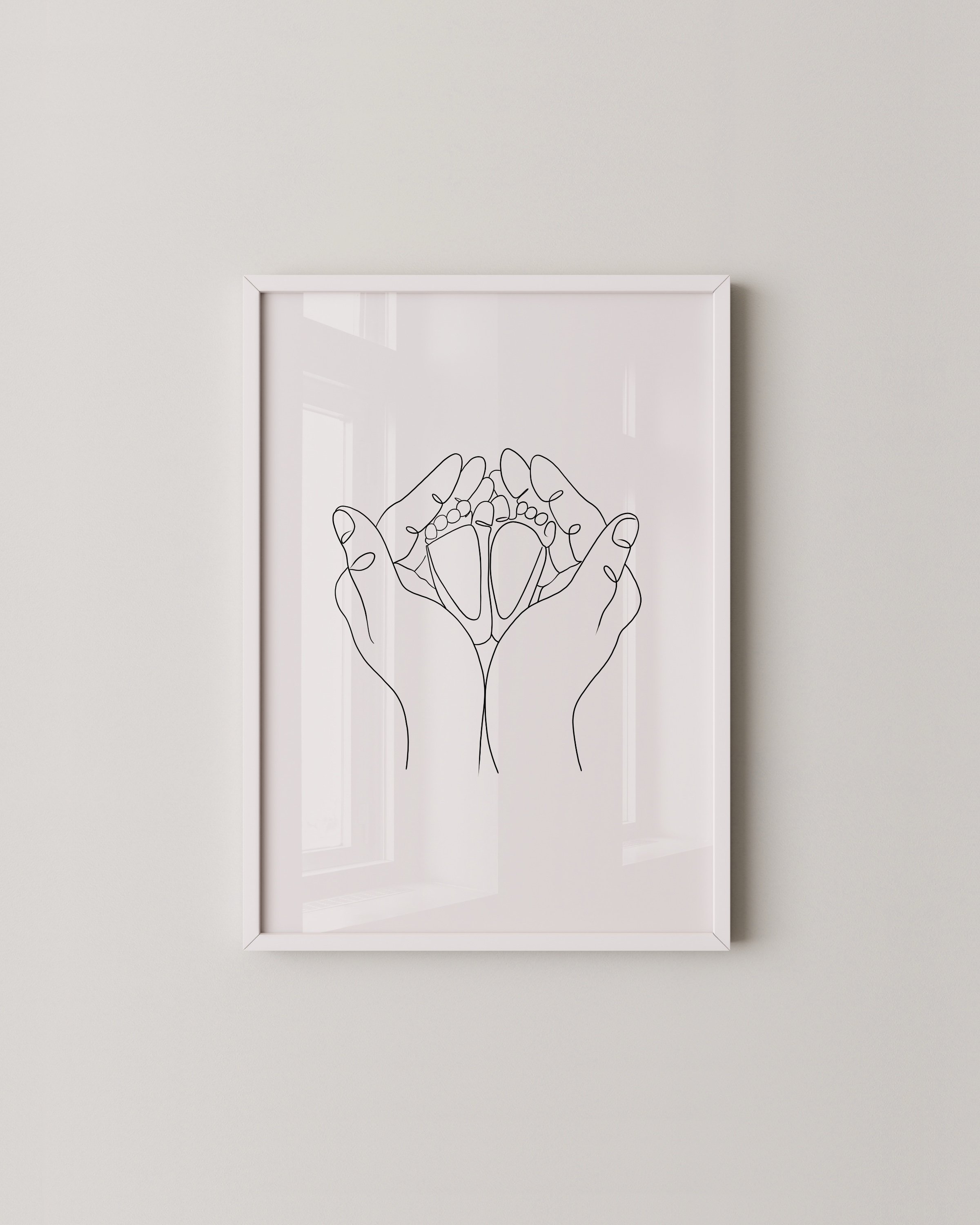 Line art of hands cradling baby feet, minimalist family artwork in a modern style.
