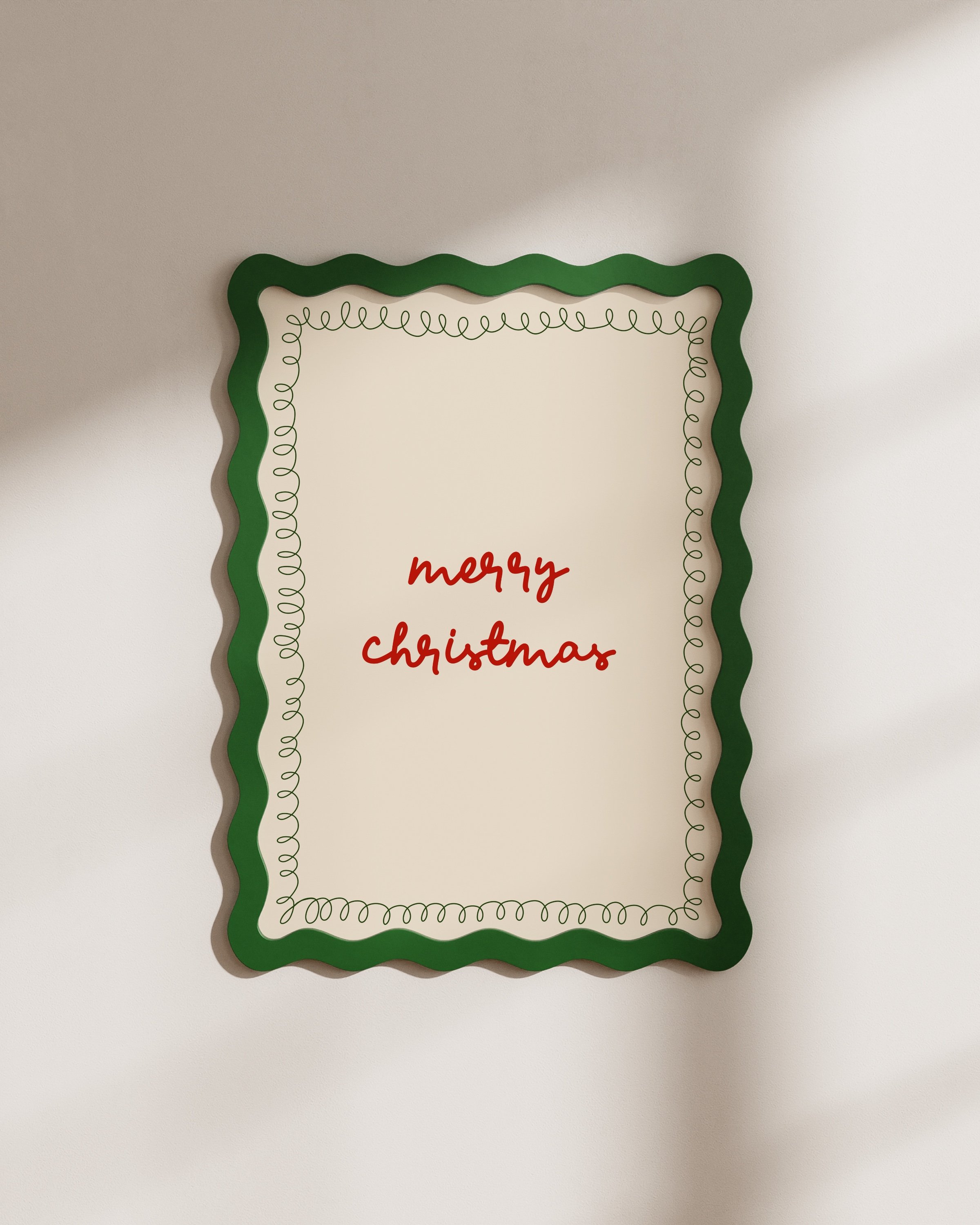 Minimalist Christmas printable art with red ‘Merry Christmas’ text in a handwritten style, framed by a green squiggle border on a beige background.