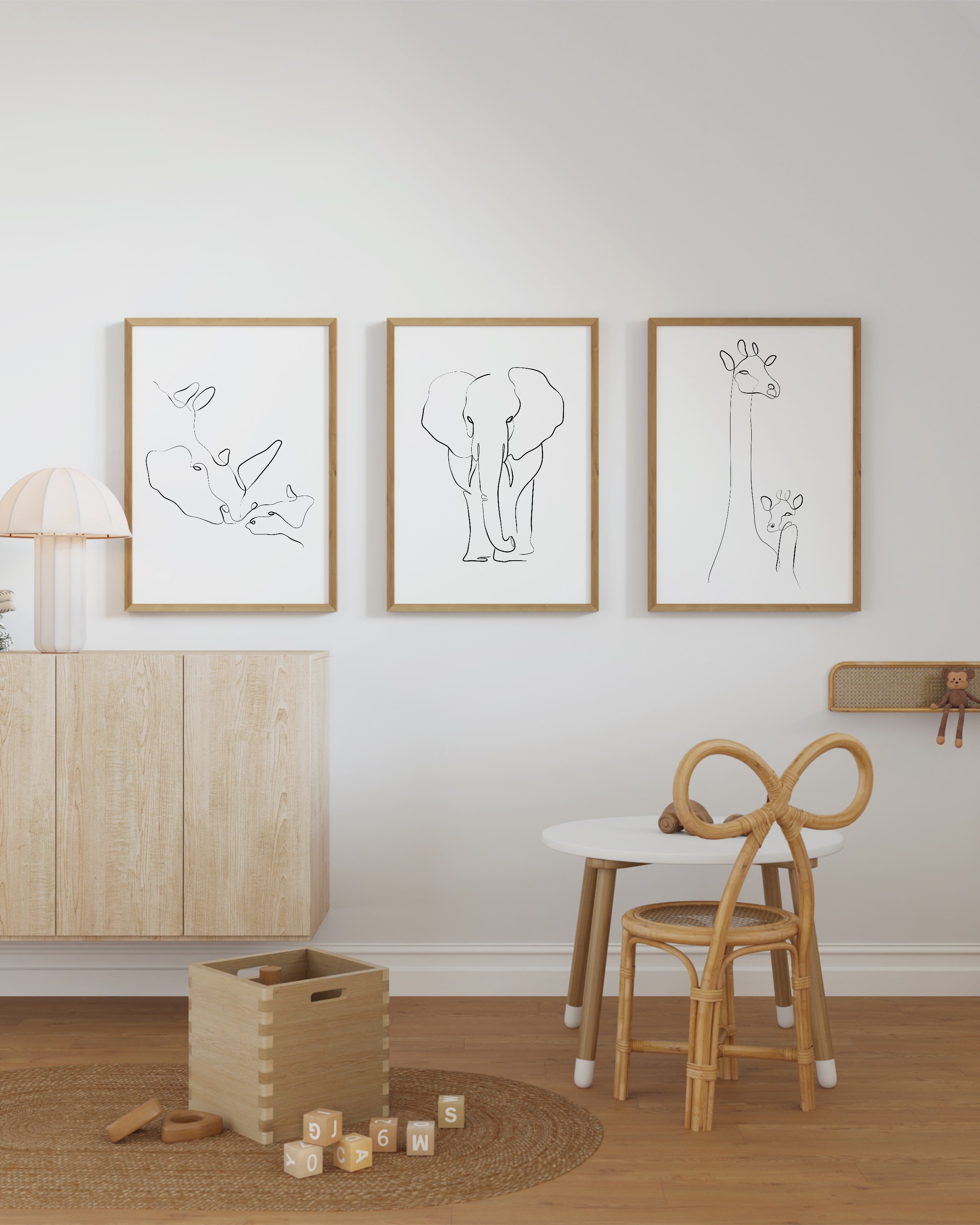 Minimalist black-and-white animal line art prints featuring an elephant, giraffe, and rhino, perfect for adding a modern touch to any space.