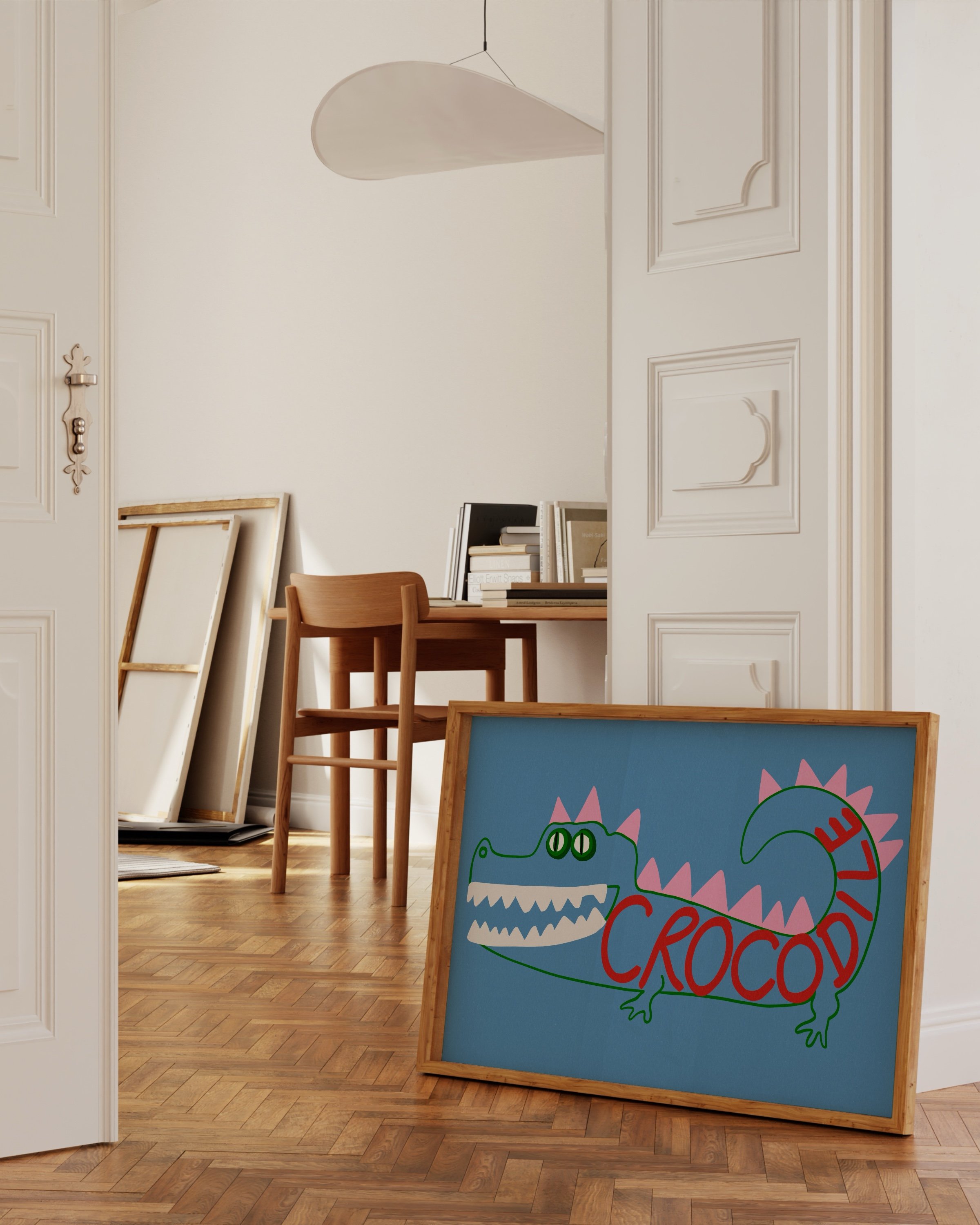 Playful crocodile art print with a blue background, featuring a colorful crocodile illustration with pink spikes and the word “Crocodile” in red.