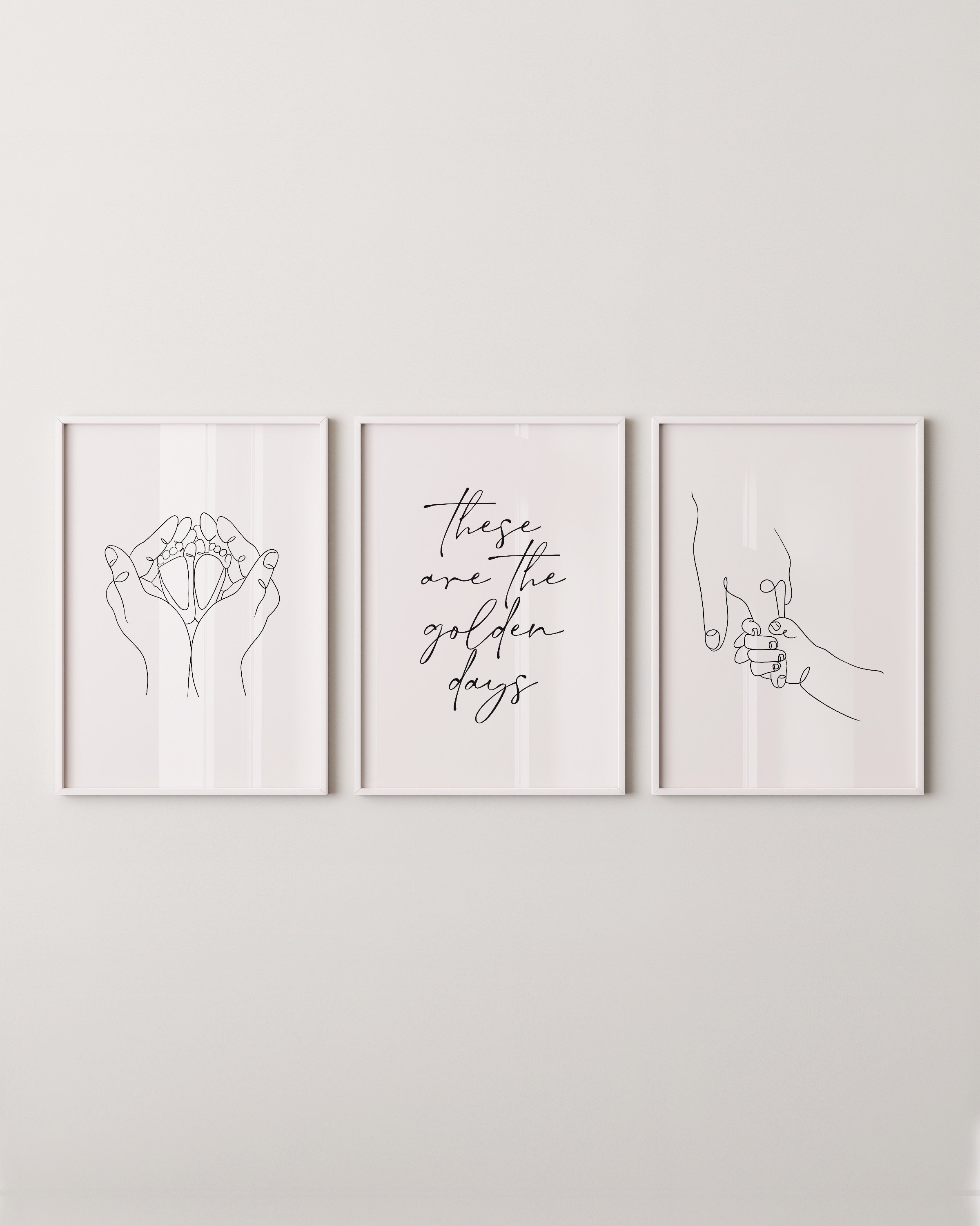 Set of 3 minimalist line art prints featuring hand-holding design, baby feet in hands, and the phrase “these are the golden days” in elegant typography.