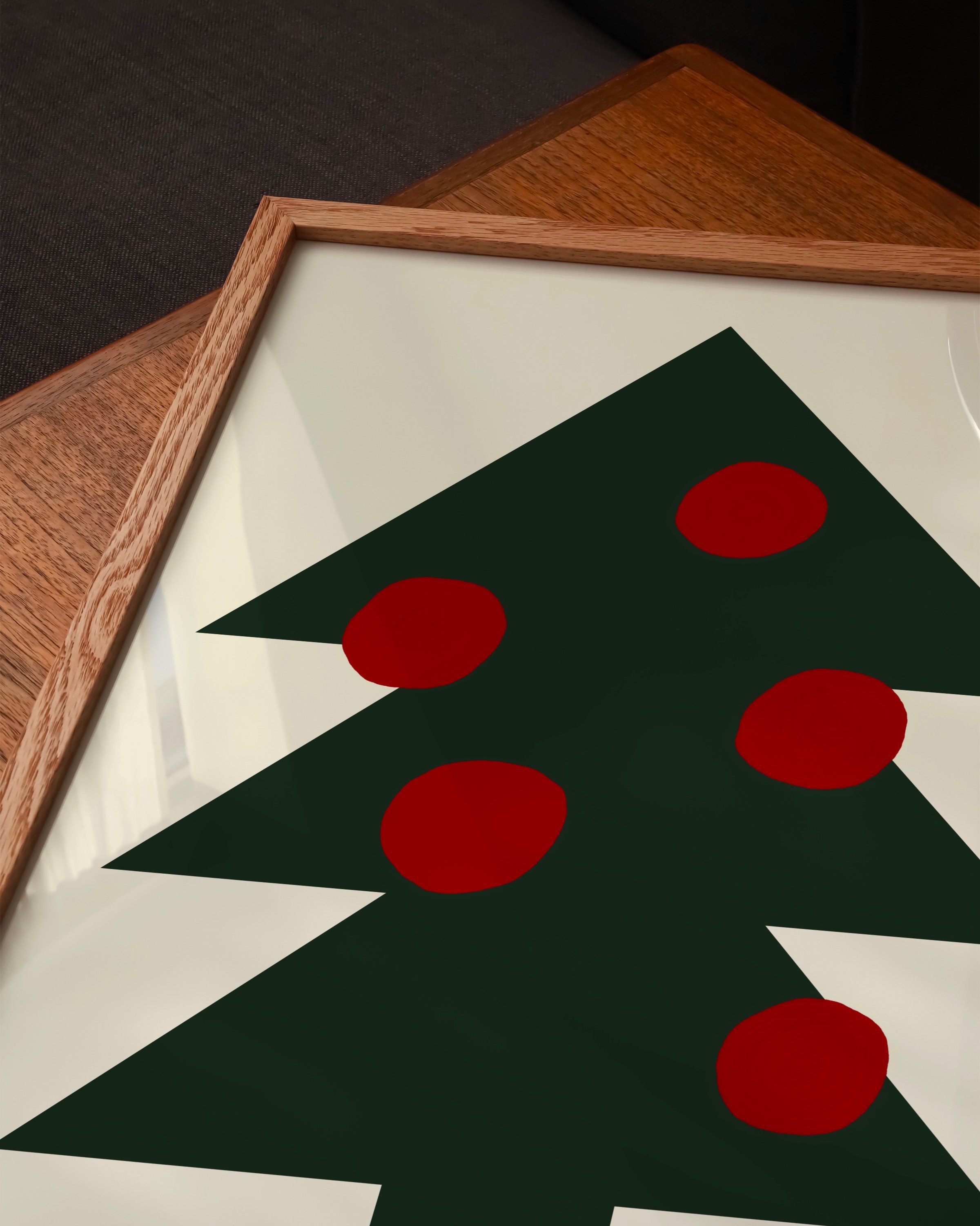 Minimalist Christmas tree art print with a dark green tree and red circle ornaments on a neutral background, designed for modern holiday decor.