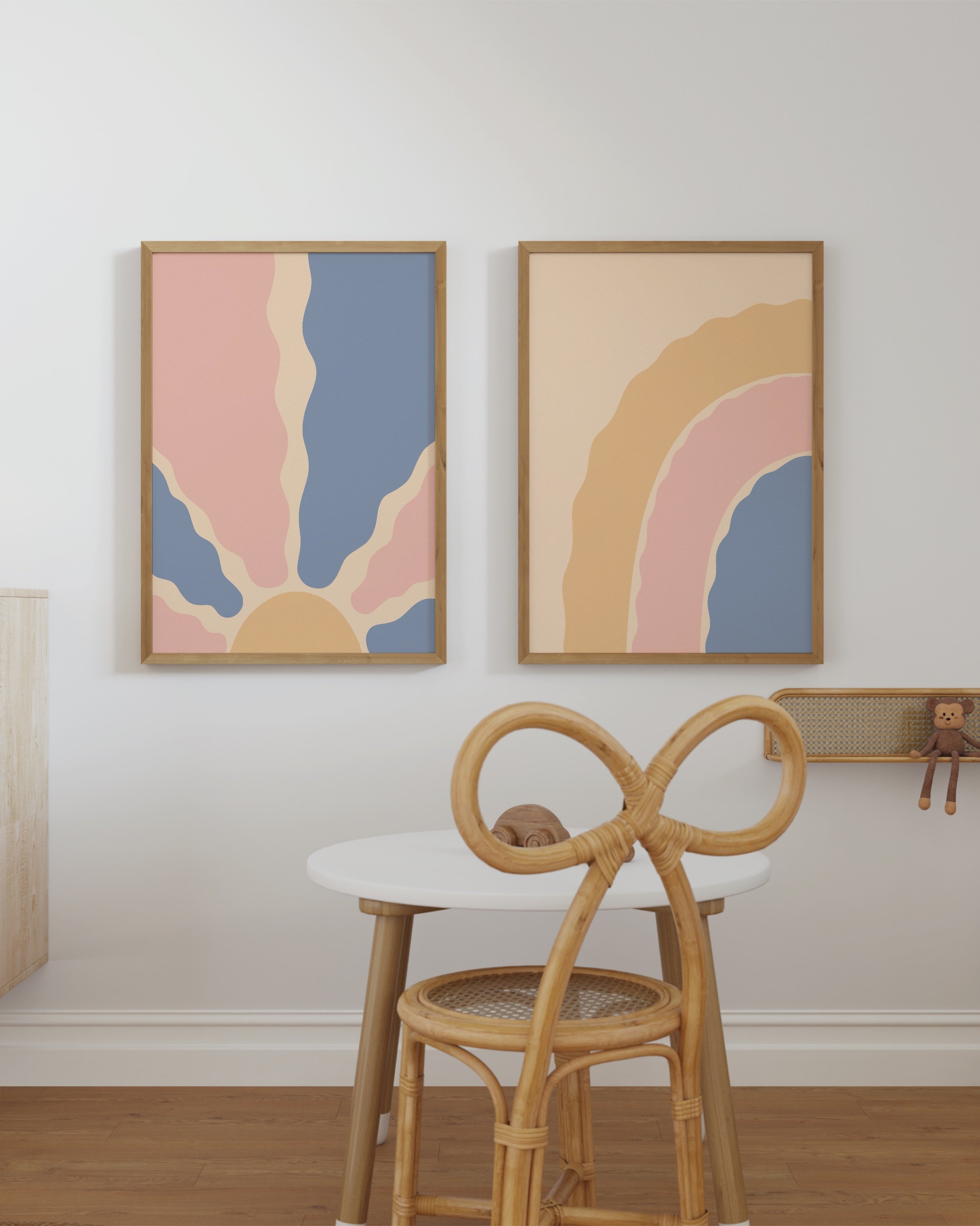 Two abstract boho printable wall art pieces: one featuring a sunburst with wavy rays, and the other a pastel rainbow in pink, blue, and beige tones.