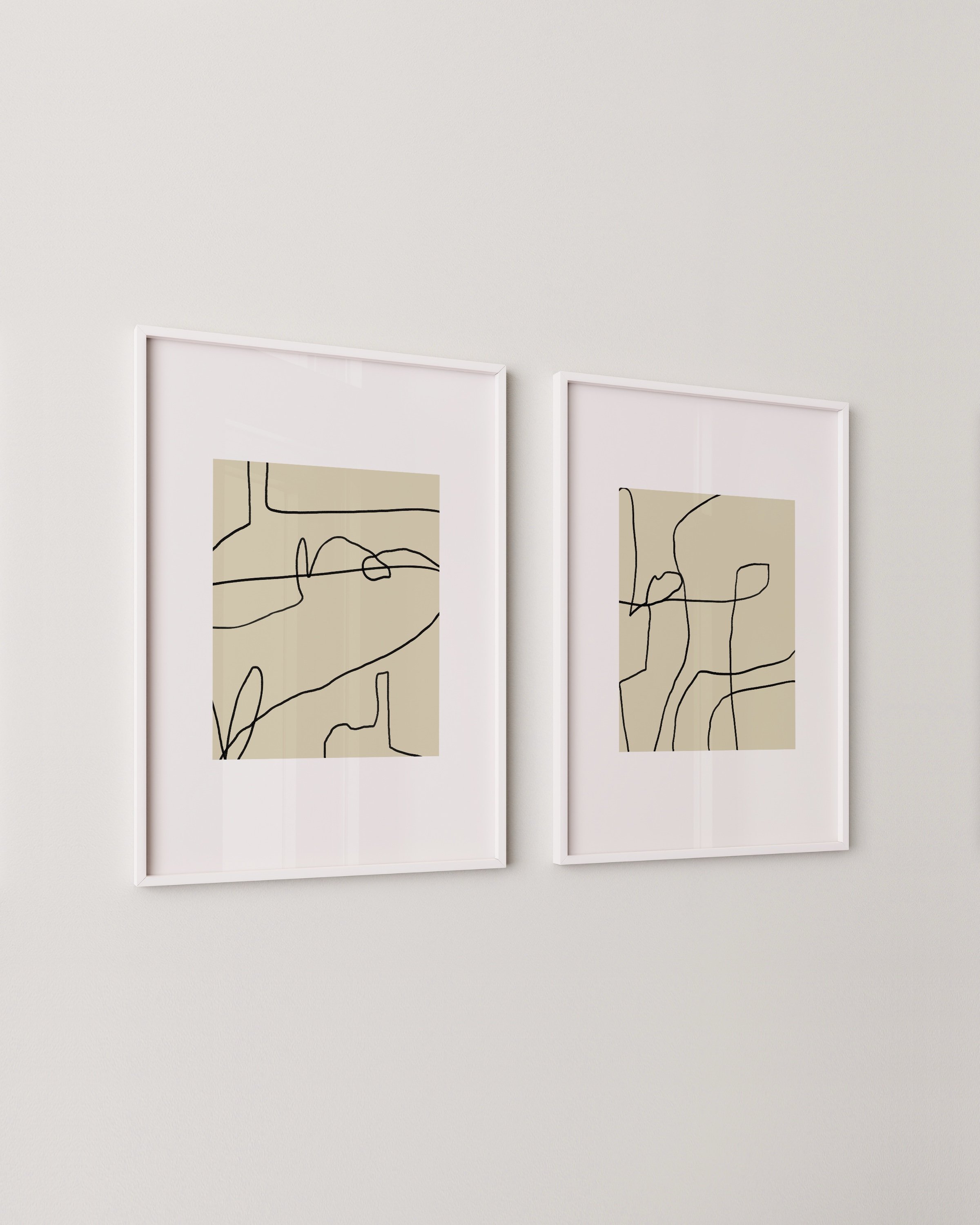 Set of two abstract line art prints in white frames, each featuring black continuous line designs over beige backgrounds with minimal, modern style.