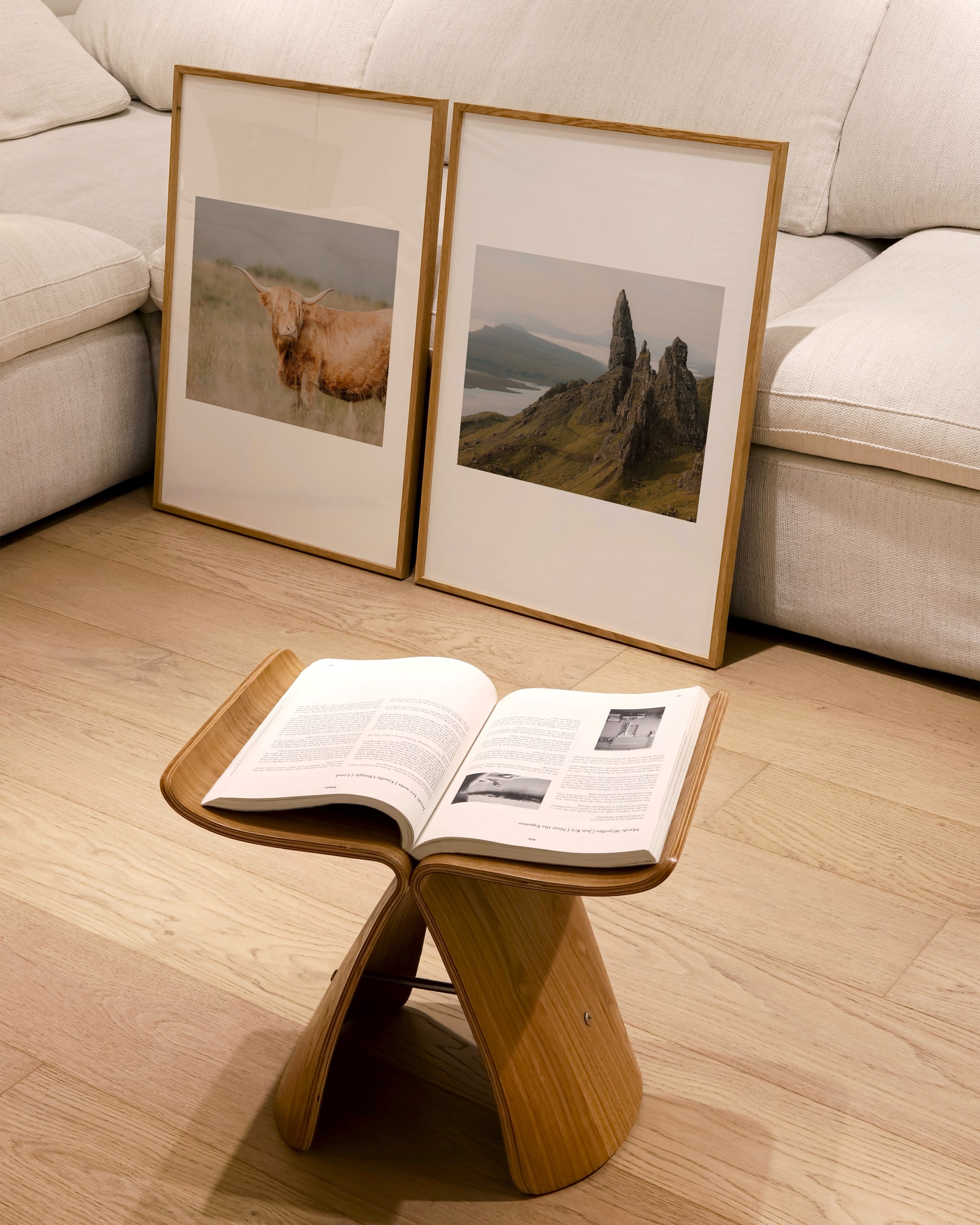 Printable art of a Highland Cow standing in a grassy field, showcasing the serene beauty of the Scottish Highlands.