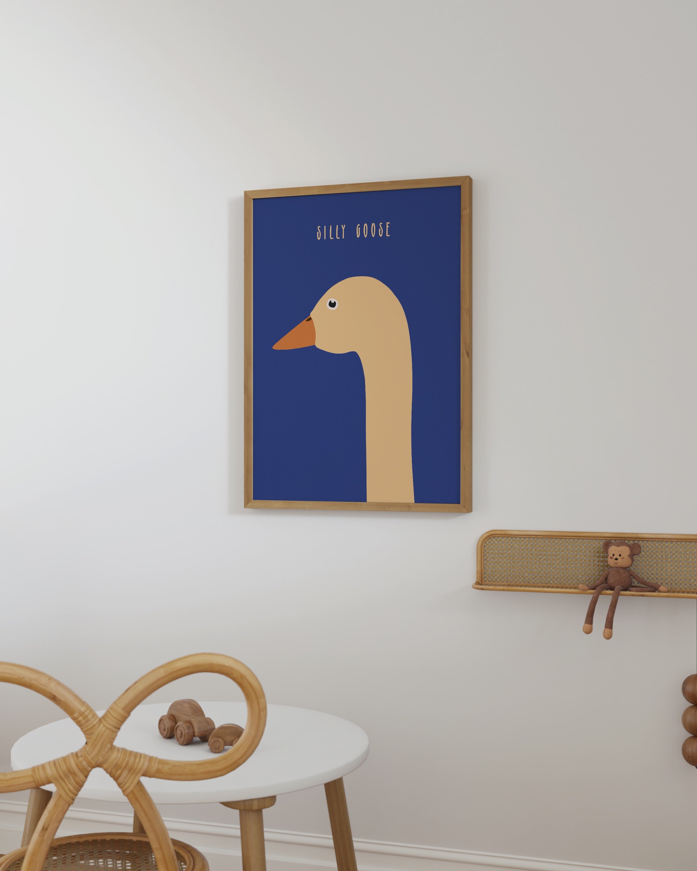 Printable wall art featuring a minimalist goose illustration on a bold blue background with the text ‘Silly Goose’ in an elegant font.