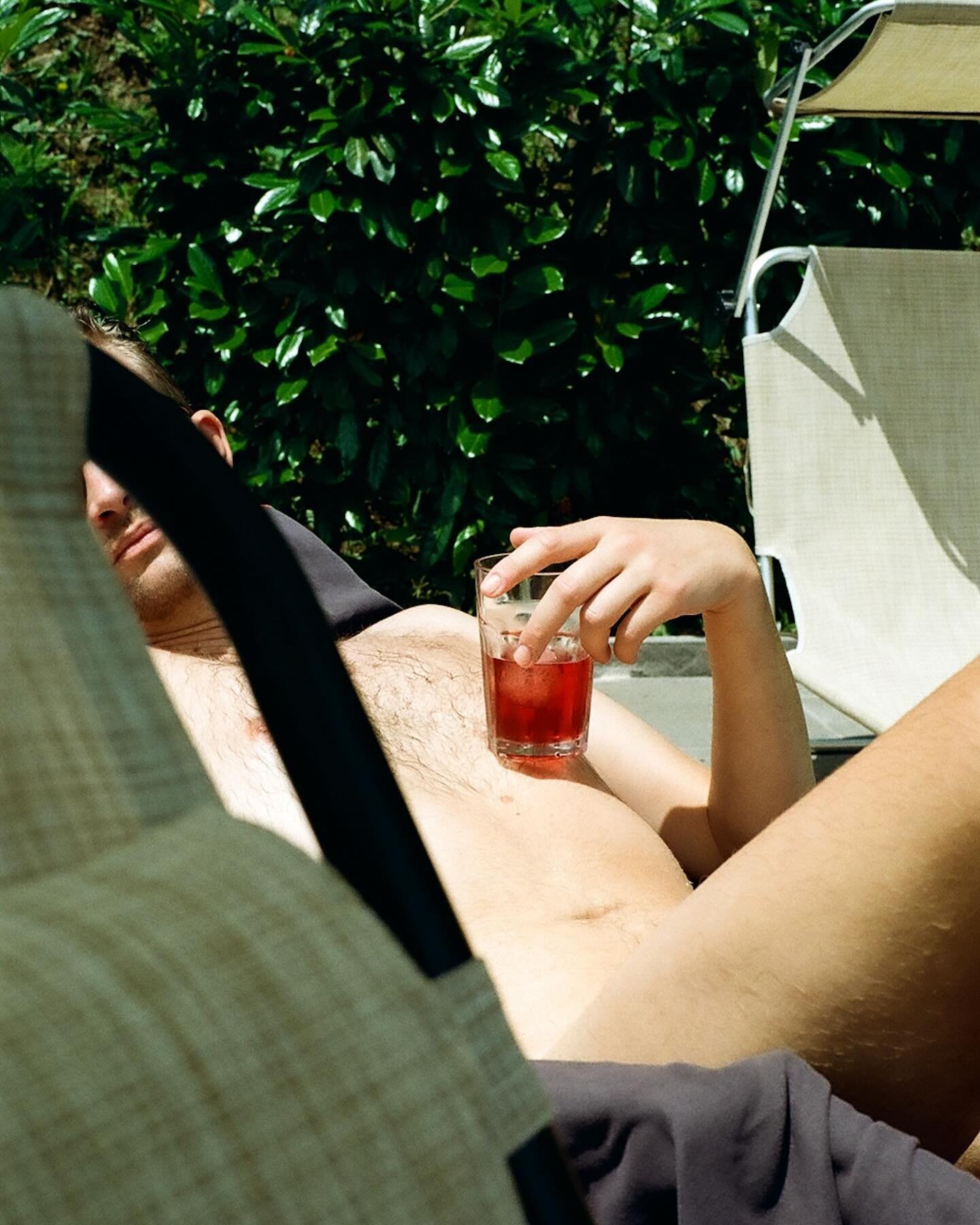 Negroni by the pool. 
What&rsquo;s your favorite drink? 

#sunkissed #onfilm #godsandboys #boysofsummer