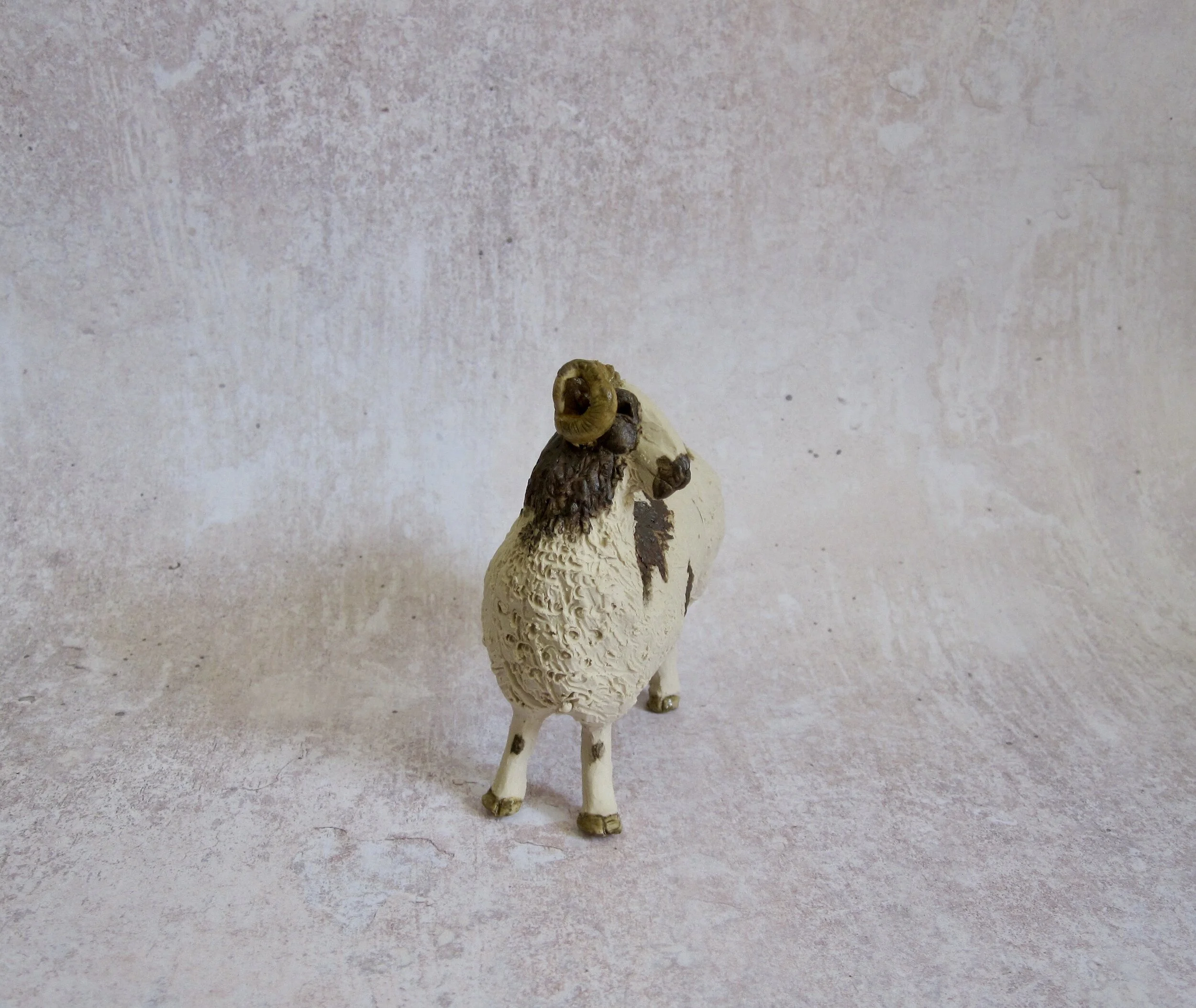Individual hand sculpted Jacob Sheep front side view