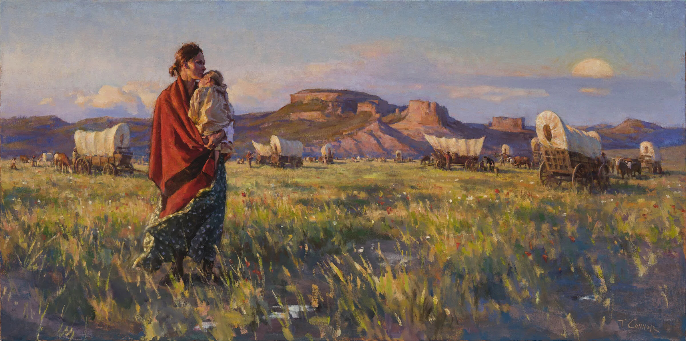 A woman carrying a child walks through a grassy field with covered wagons and horses, with a canyon and a setting sun in the background.