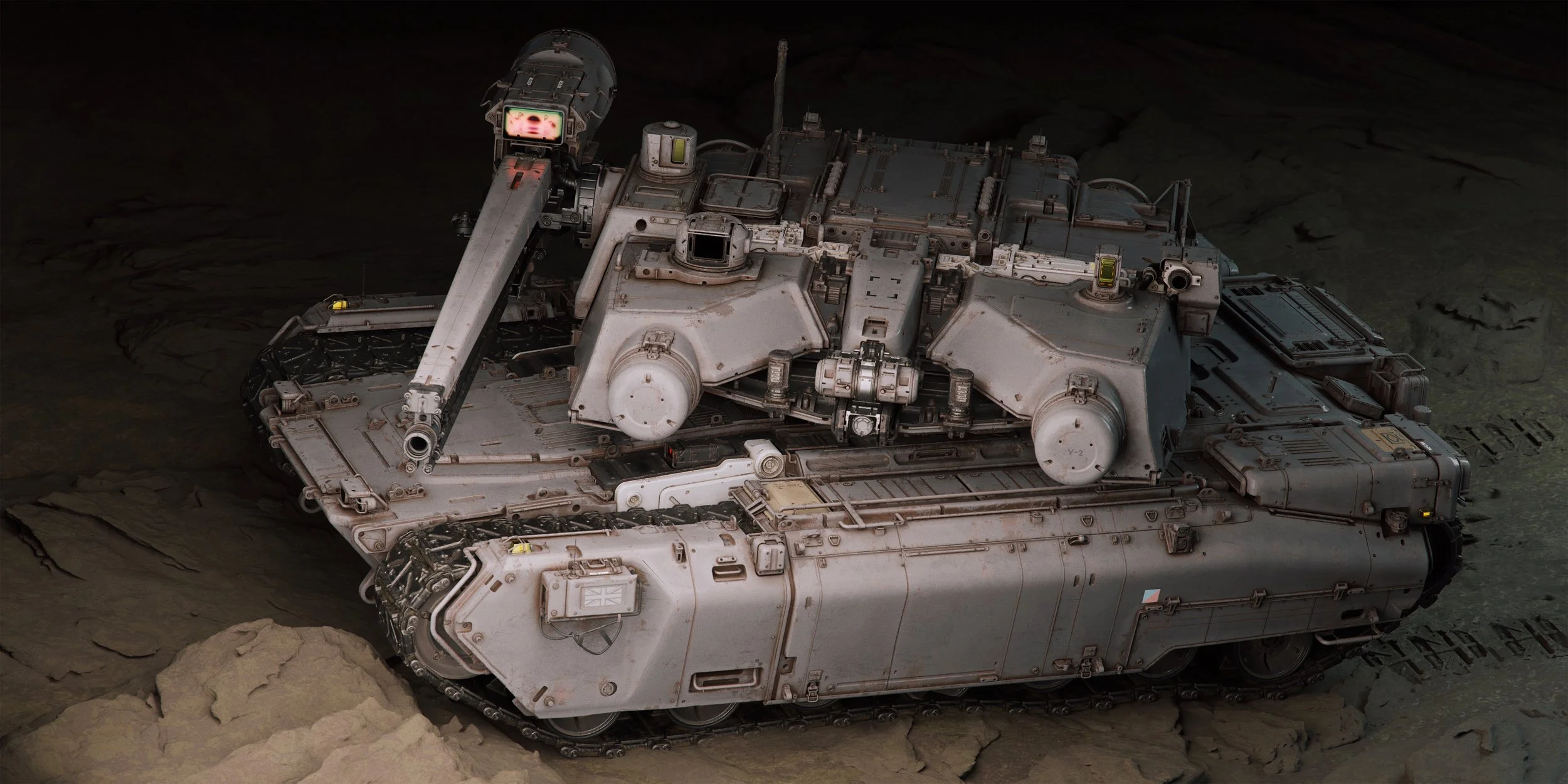 A detailed military tank in a rough, rocky terrain, with track wheels and various hatches visible, possibly in a desert or barren landscape.