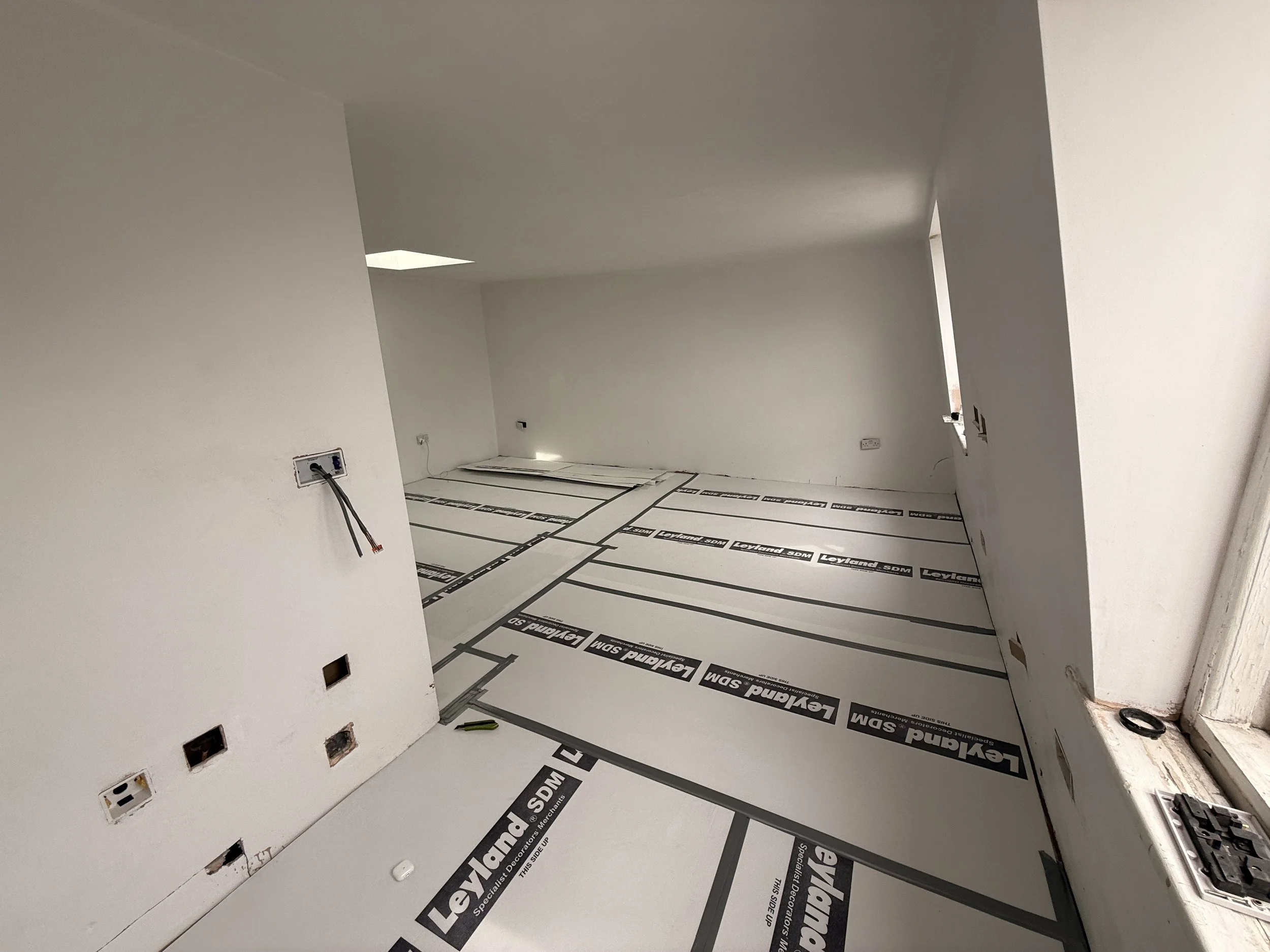 The floor laid and then completely protected.jpeg