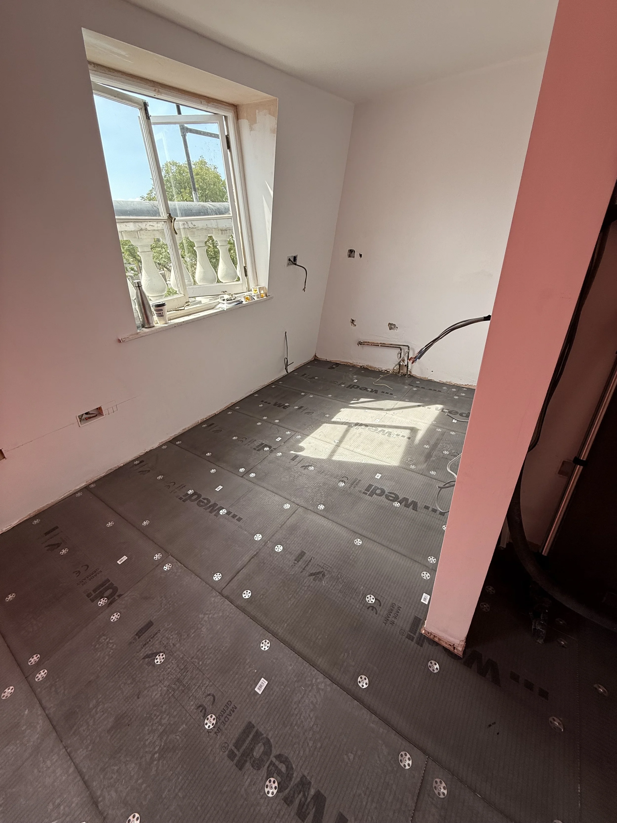 Layer one on top of the sub flooring.jpeg