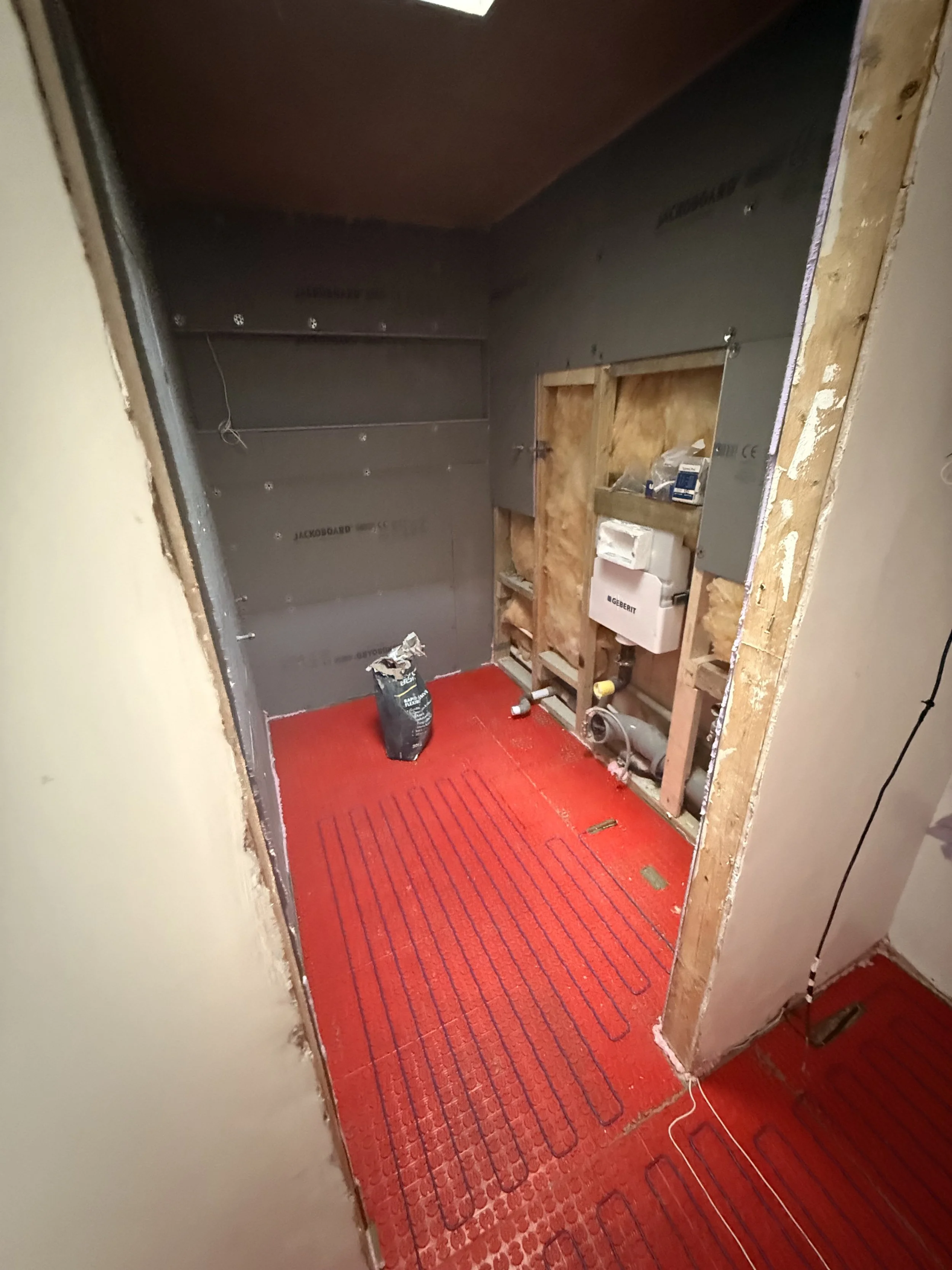 Underfloor heating being layed in bathroom.jpeg