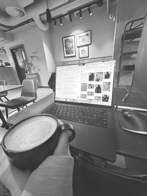 Black and white coffee and laptop café work