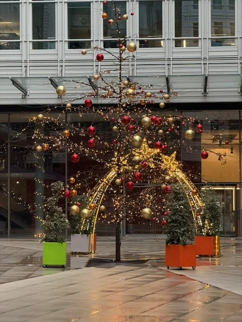 Golden Christmas tree arch installation London
