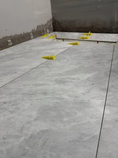 First floor tiles set with spacers during bathroom rebuild