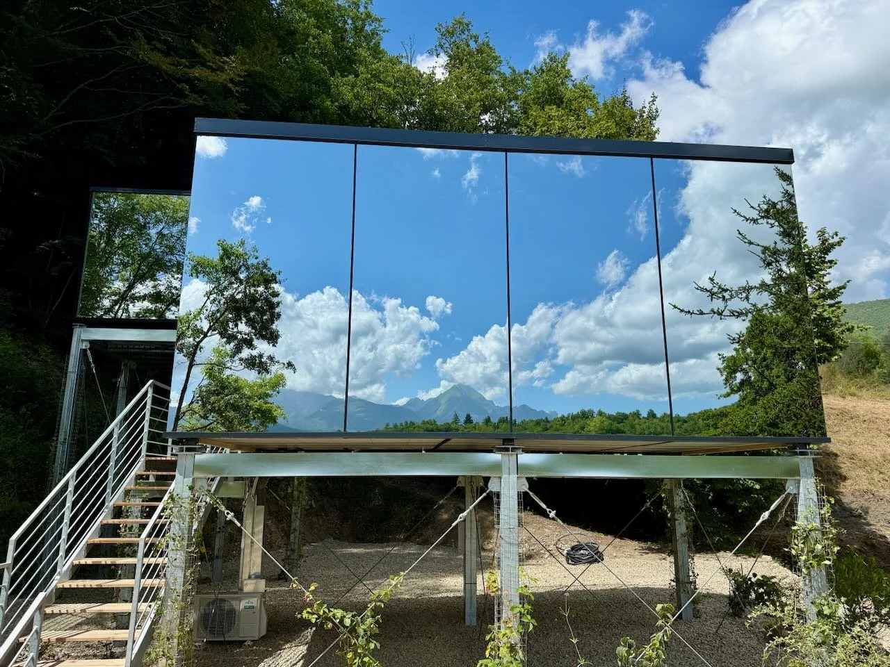Outside looking up at the OOD mirrored exterior in Tuscany